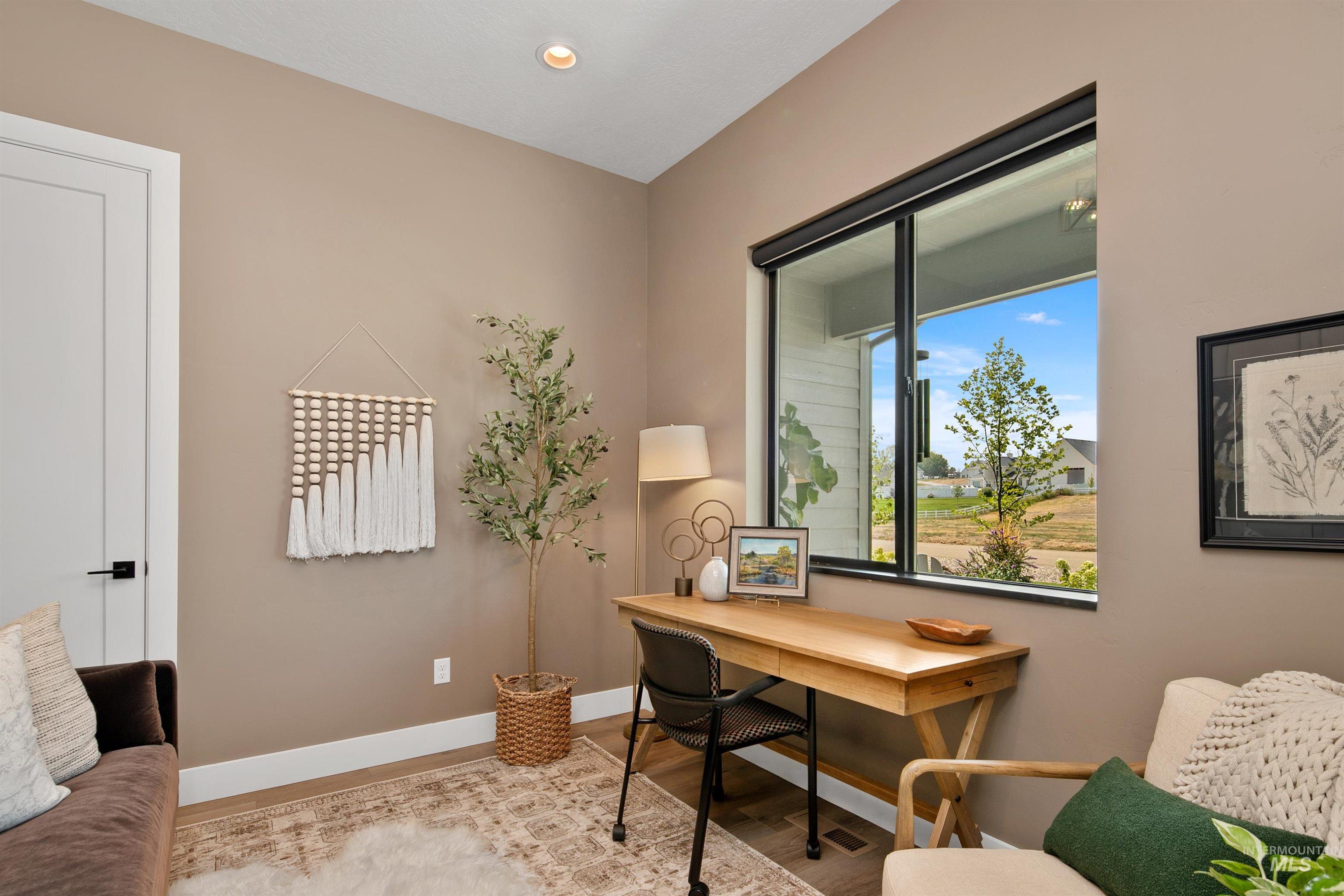 Office area featuring wood finished floors and recessed lighting