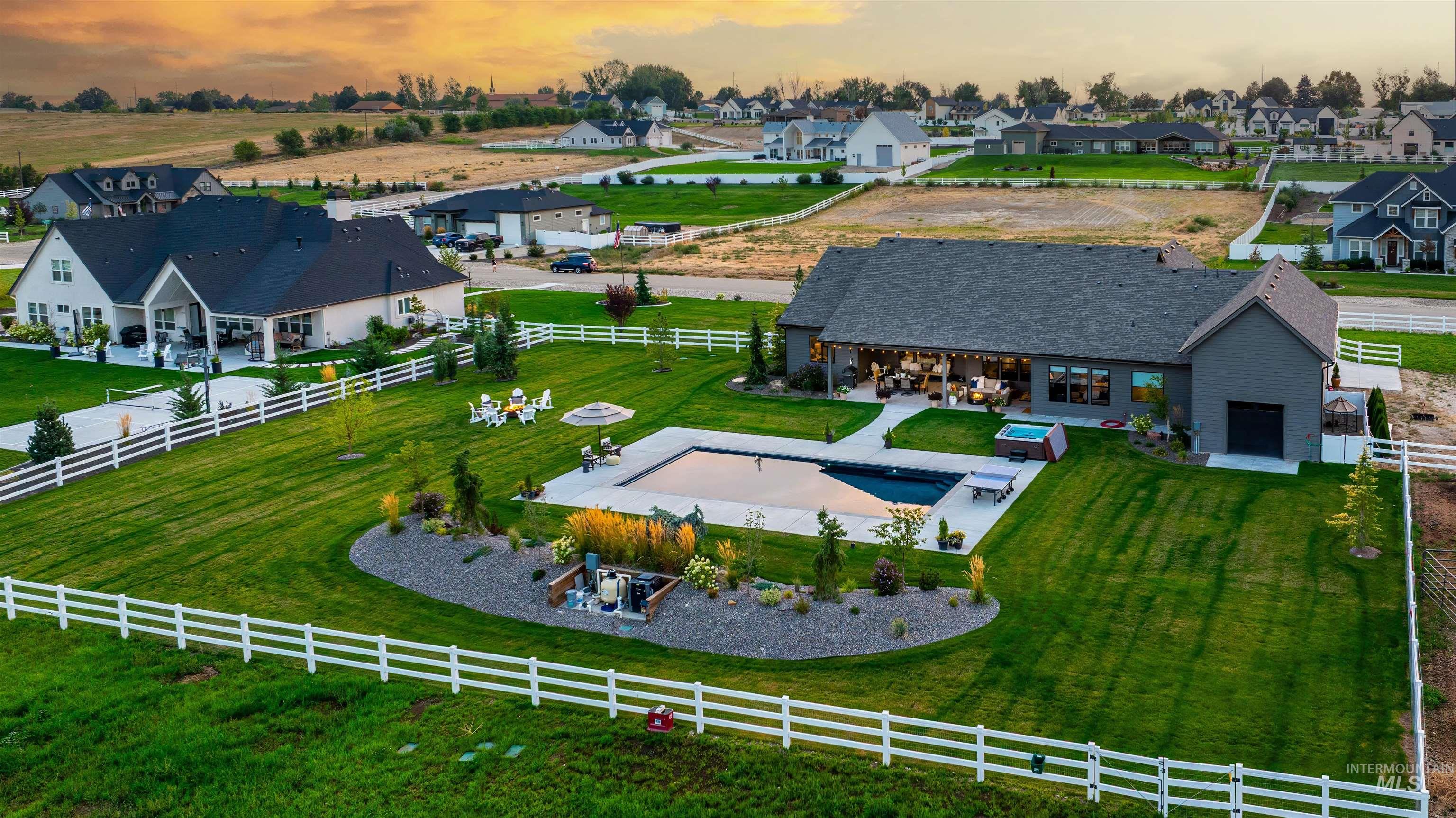 Overview of rural landscape with a pool area and nearby suburban area