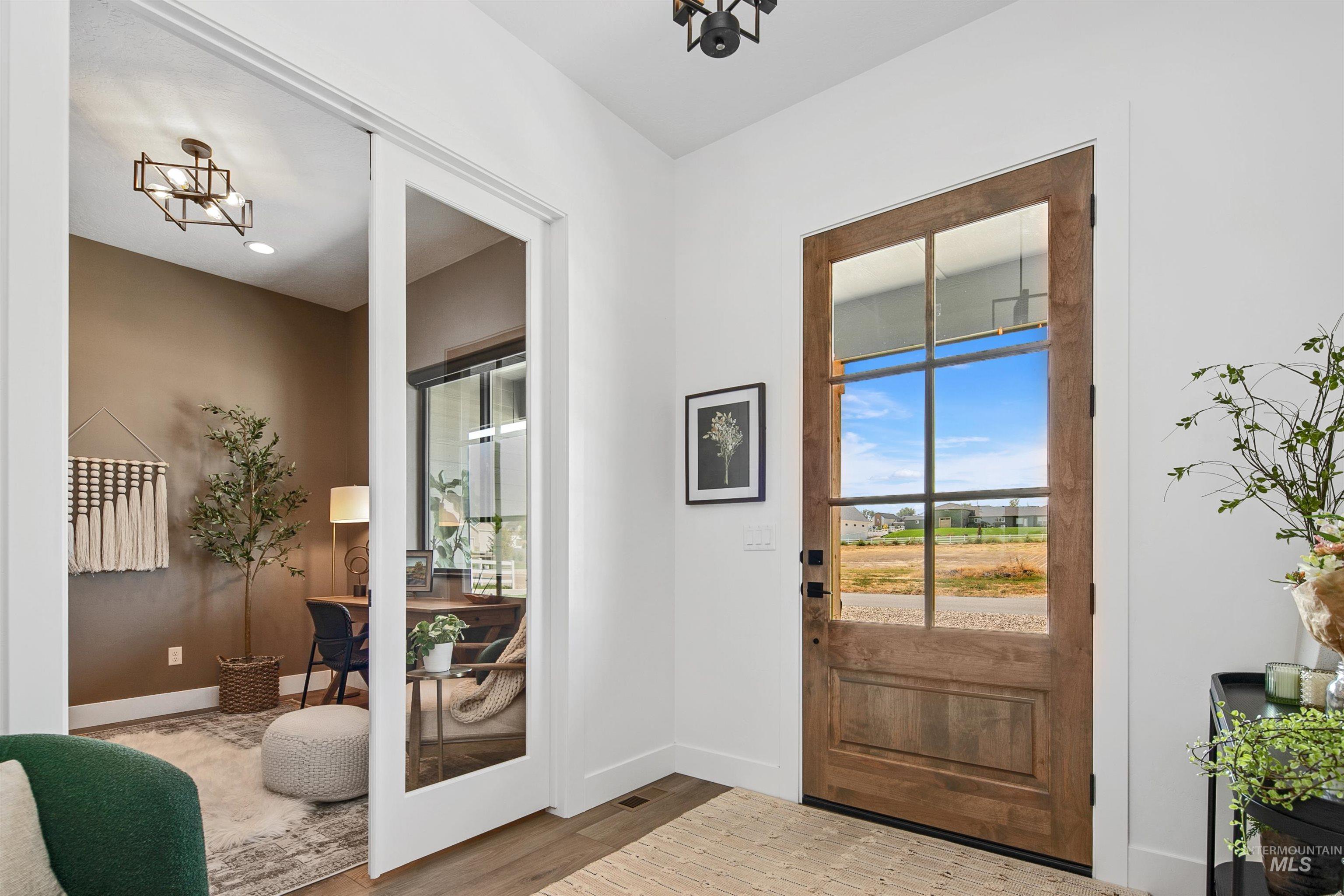 Entryway featuring wood finished floors and recessed lighting