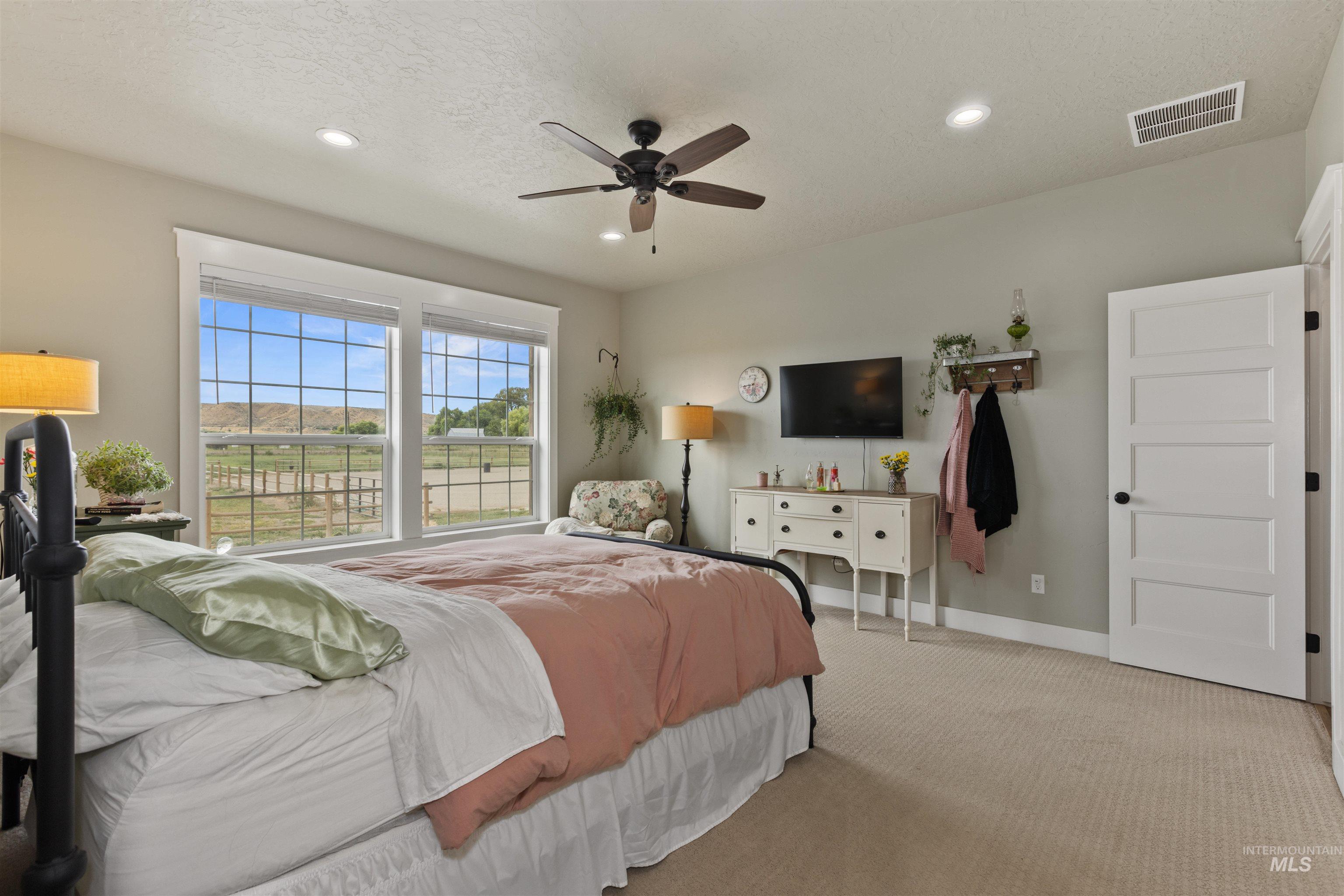Bedroom with carpet, recessed lighting, and a ceiling fan