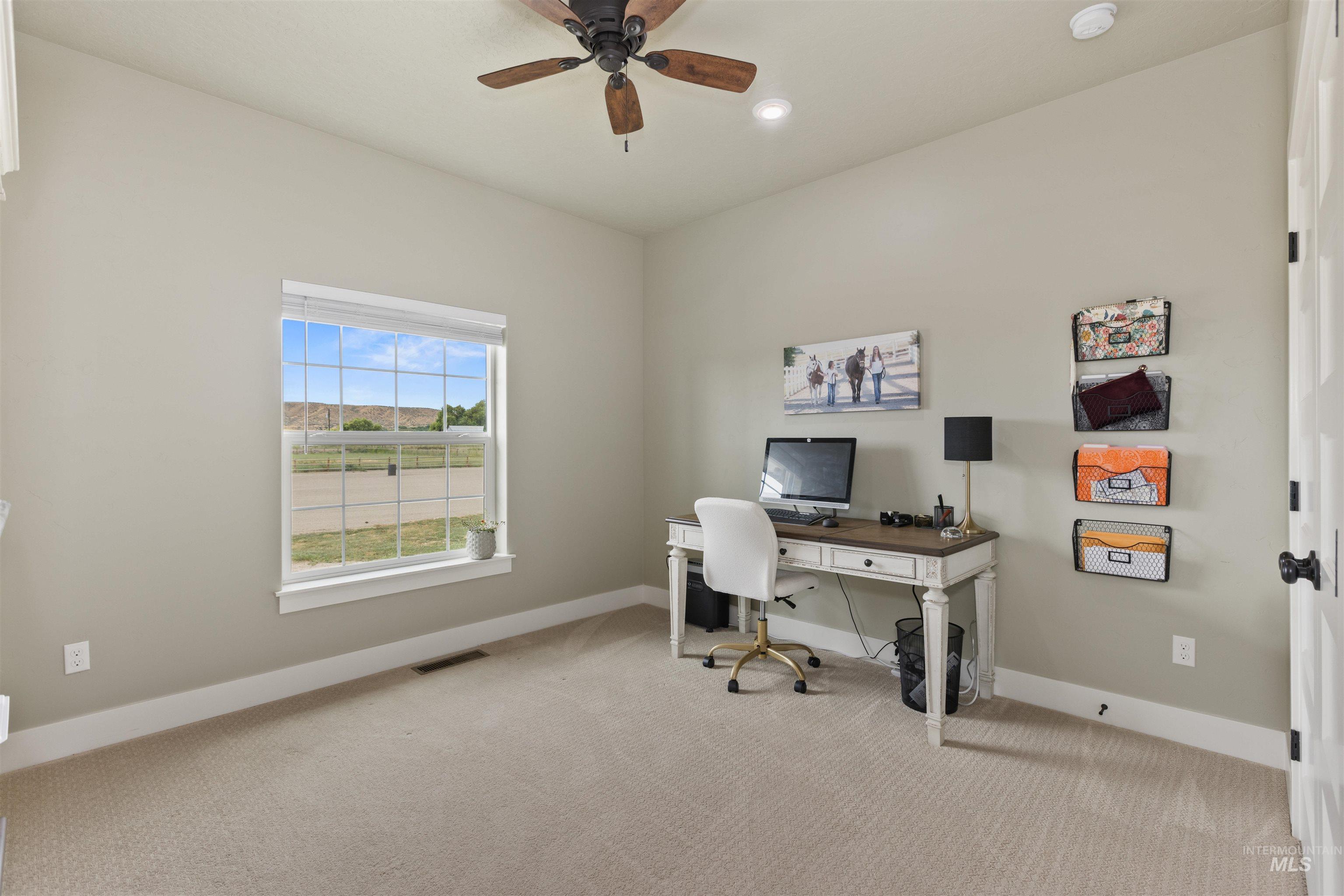 Bedroom featuring carpet flooring, a ceiling fan, and recessed lighting