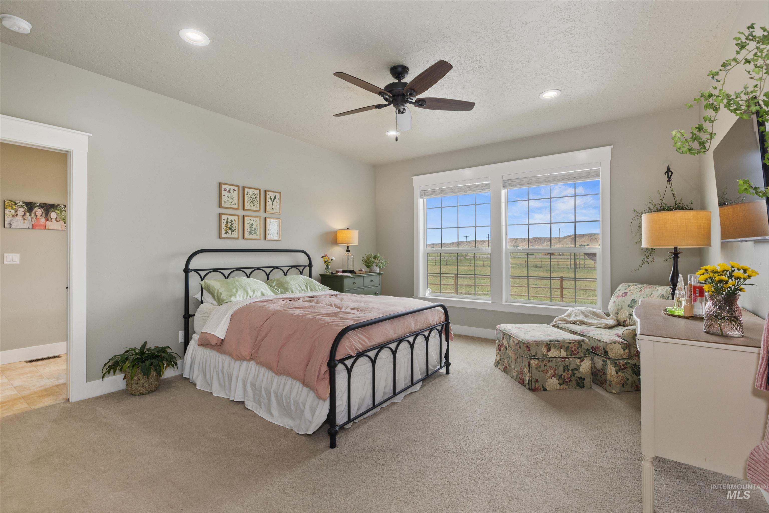Carpeted bedroom featuring recessed lighting and ceiling fan