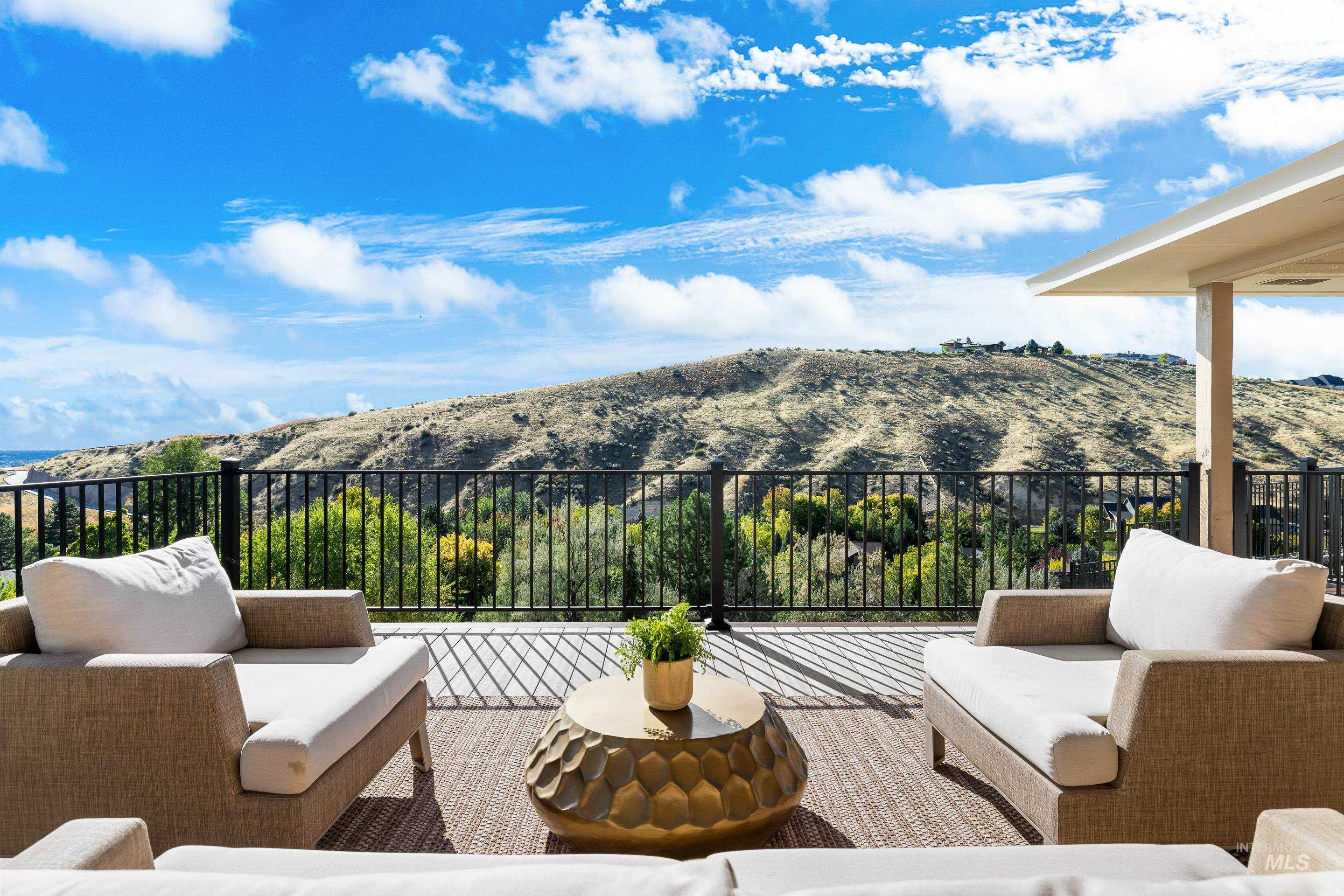 View of patio / terrace with an outdoor living space and a mountain view