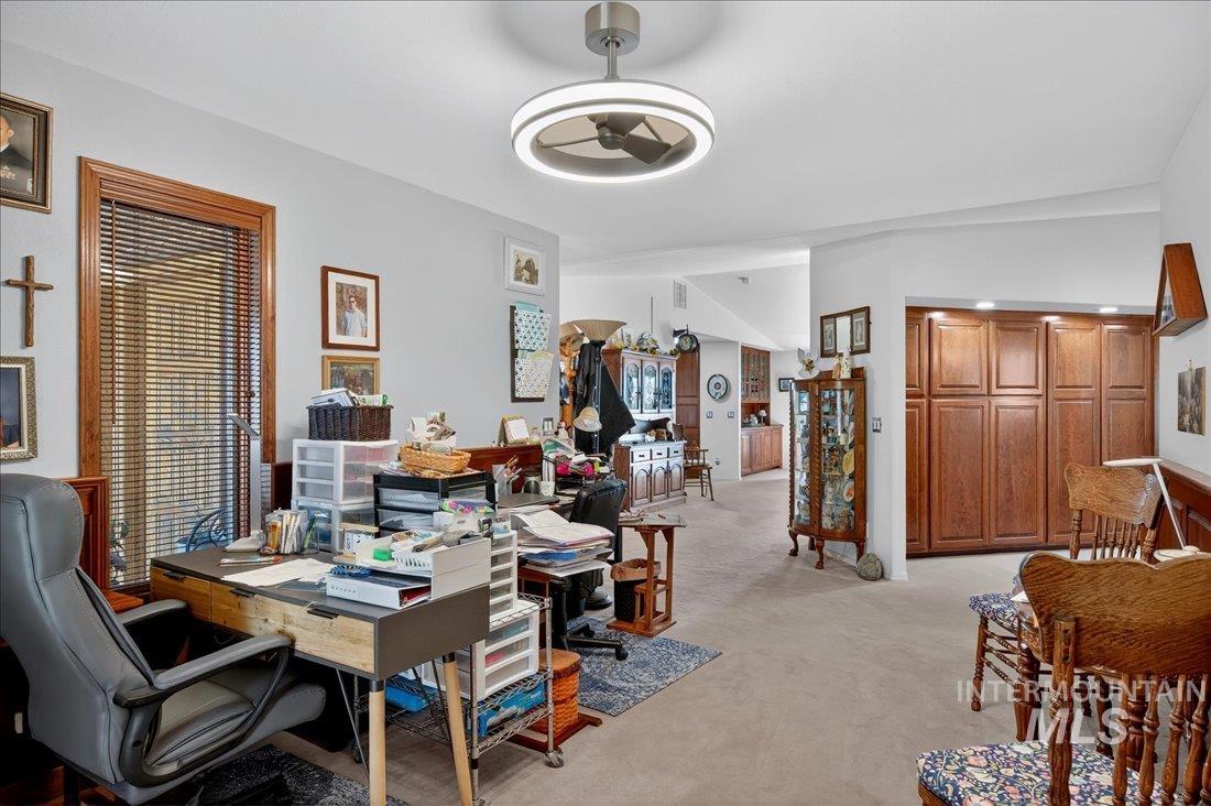 Office featuring light carpet and a ceiling fan