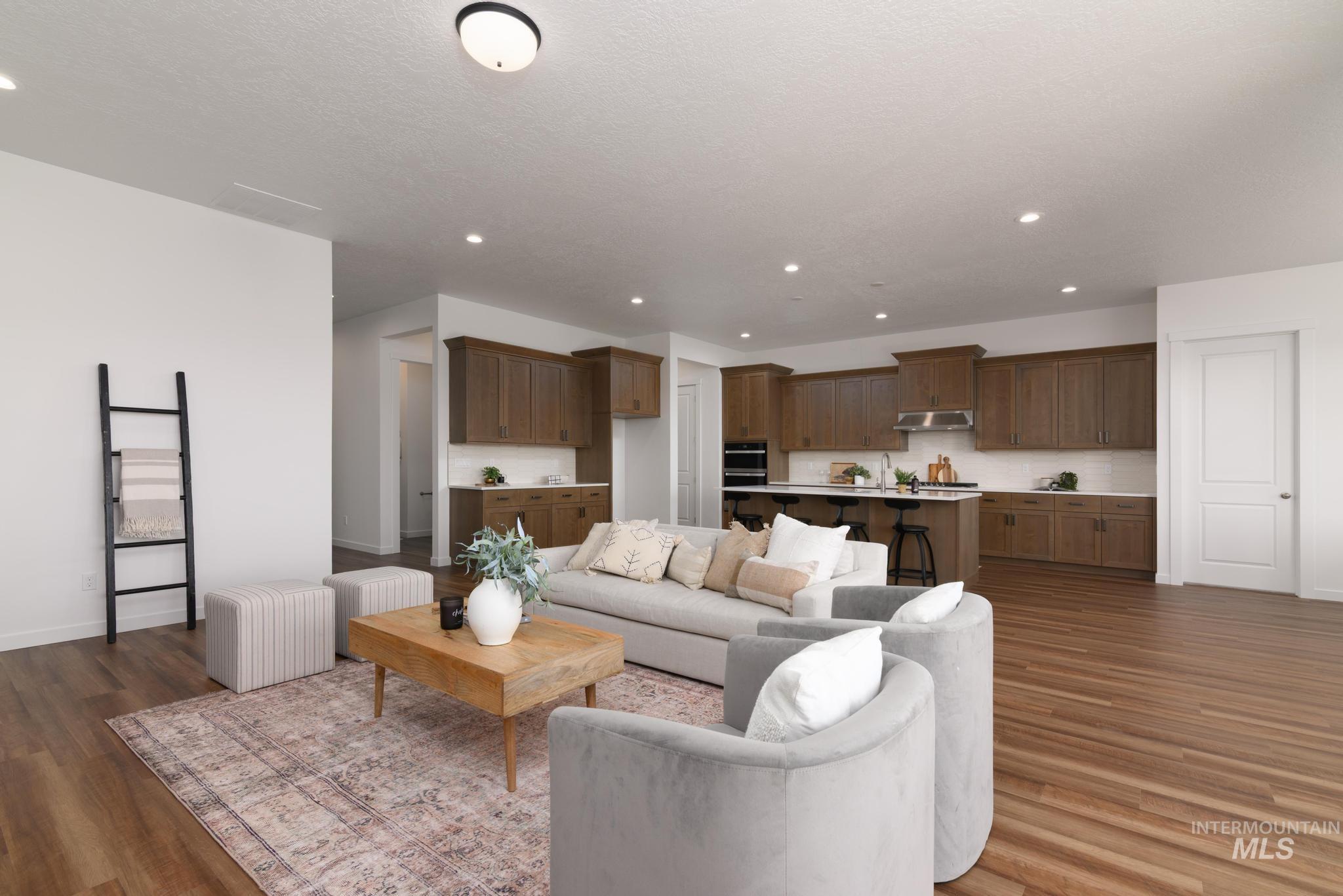 Living room featuring recessed lighting and dark wood finished floors
