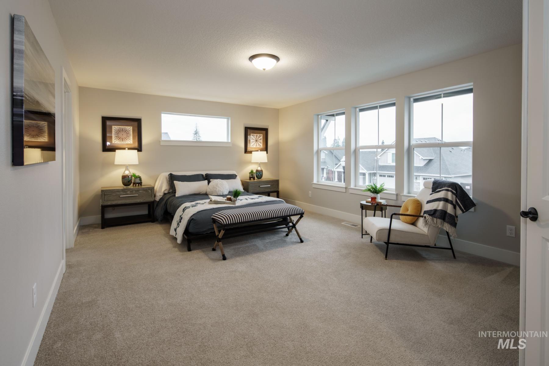 Carpeted bedroom with baseboards