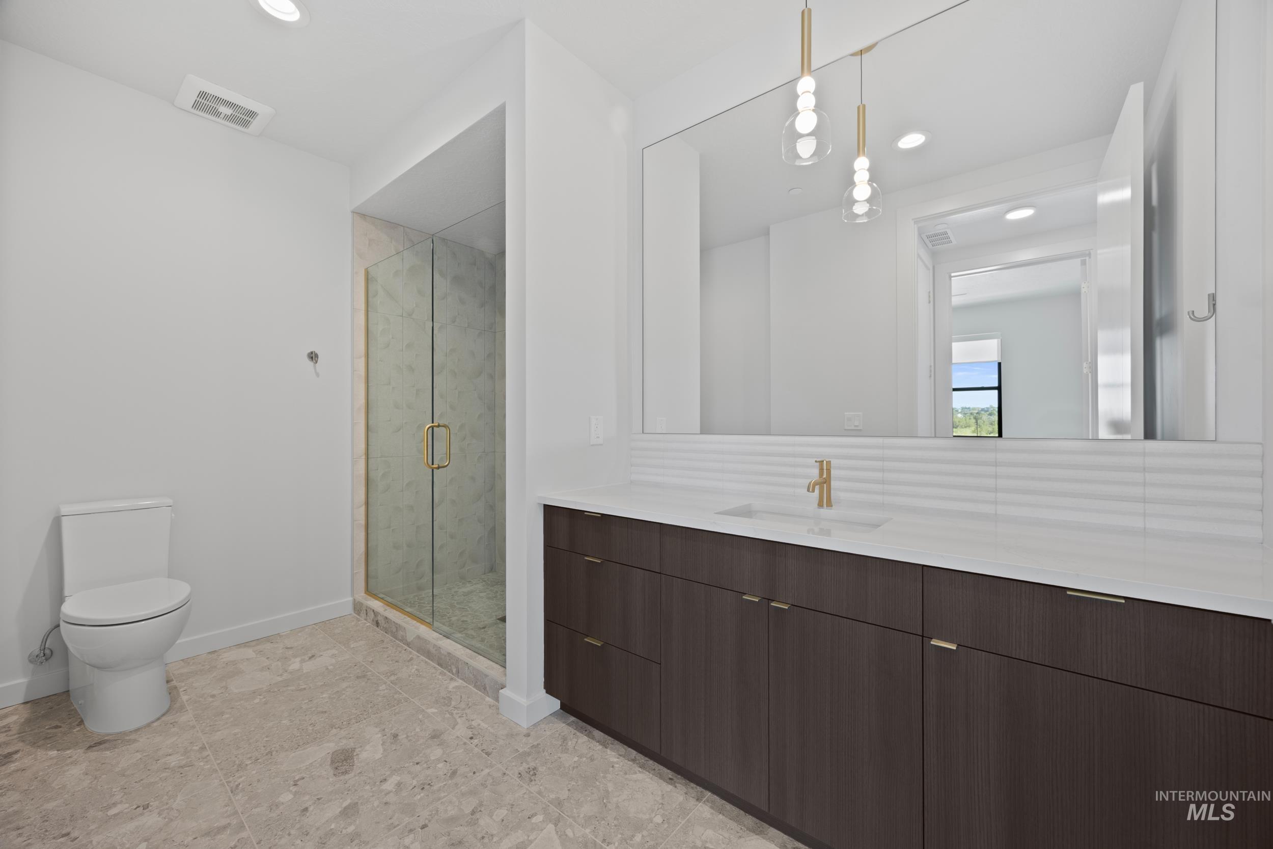 Bathroom with vanity, a shower stall, recessed lighting, and light tile patterned flooring