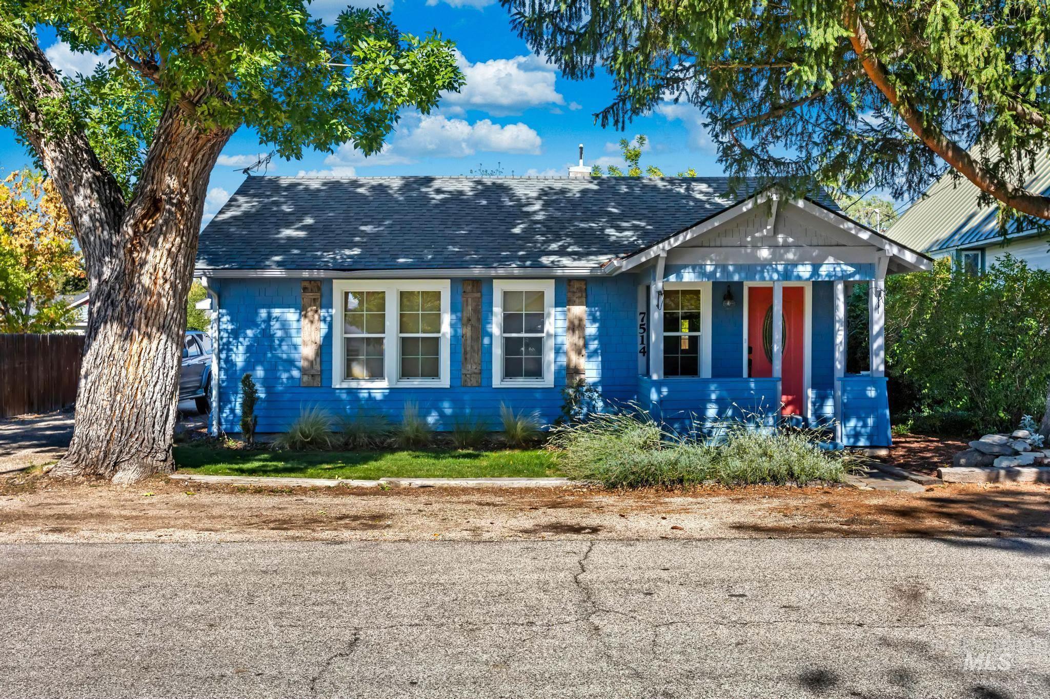 Bungalow-style house with covered porch and a shingled roof