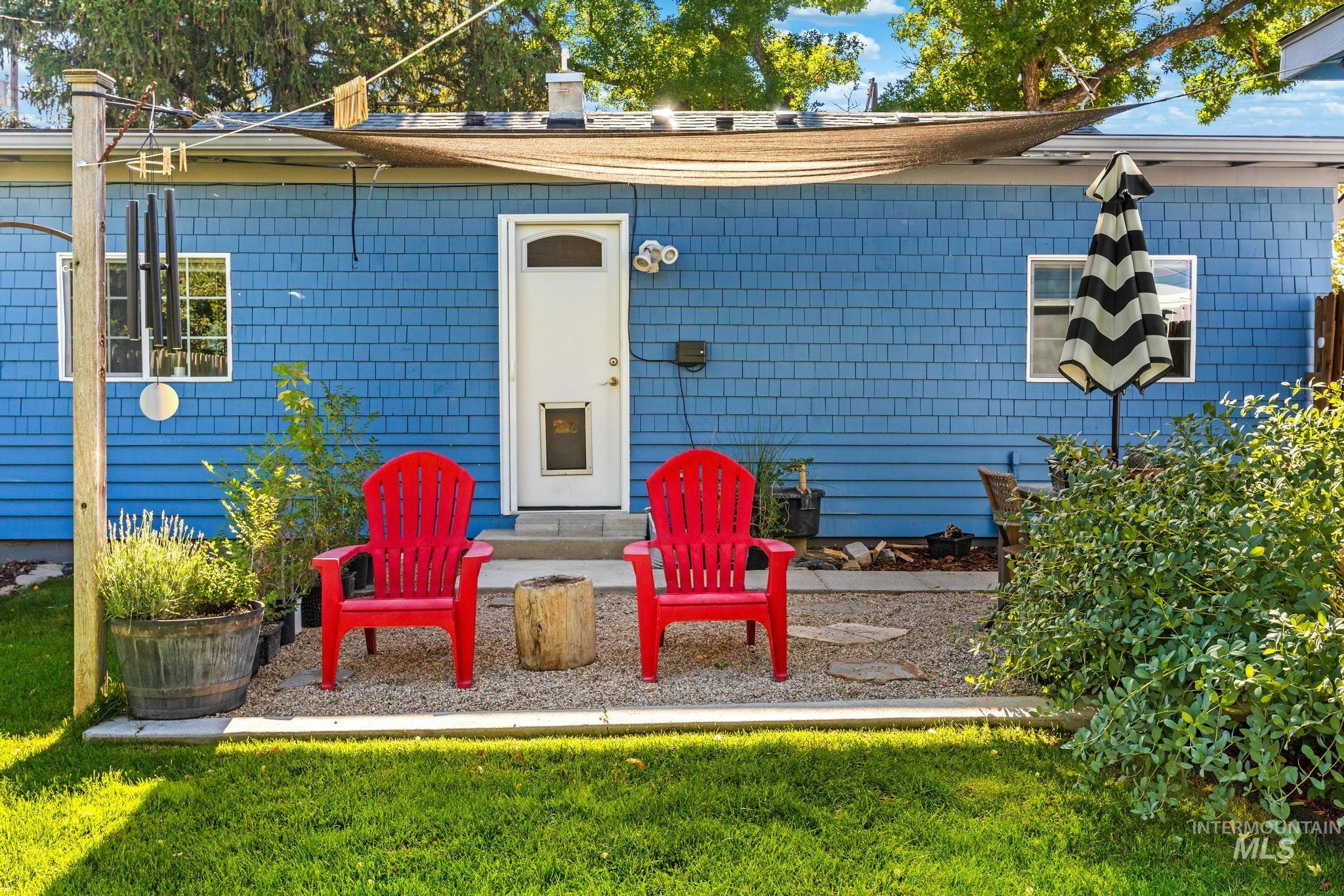 Property entrance with a yard and a chimney