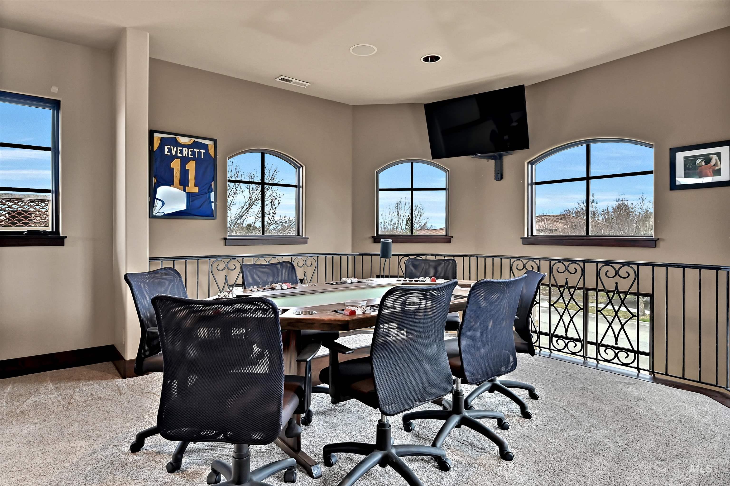 Office area featuring carpet and baseboards