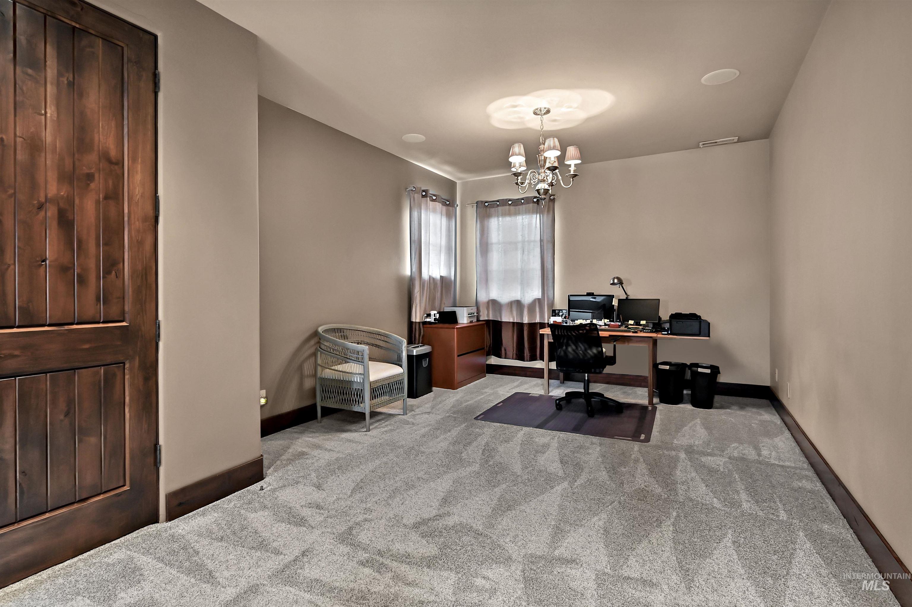 Bedroom with light carpet and decorative lights