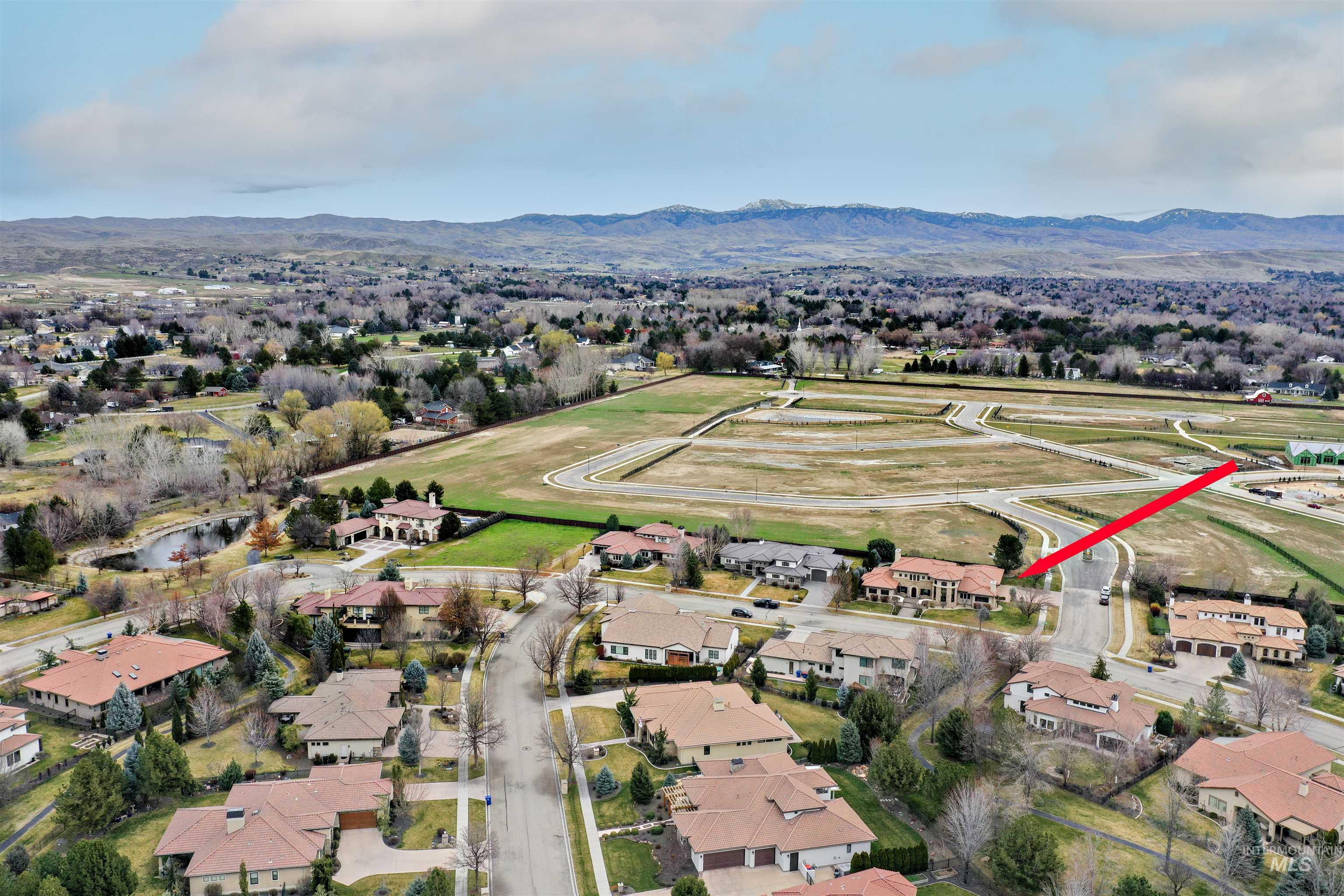 Aerial view of residential area featuring a mountain backdrop