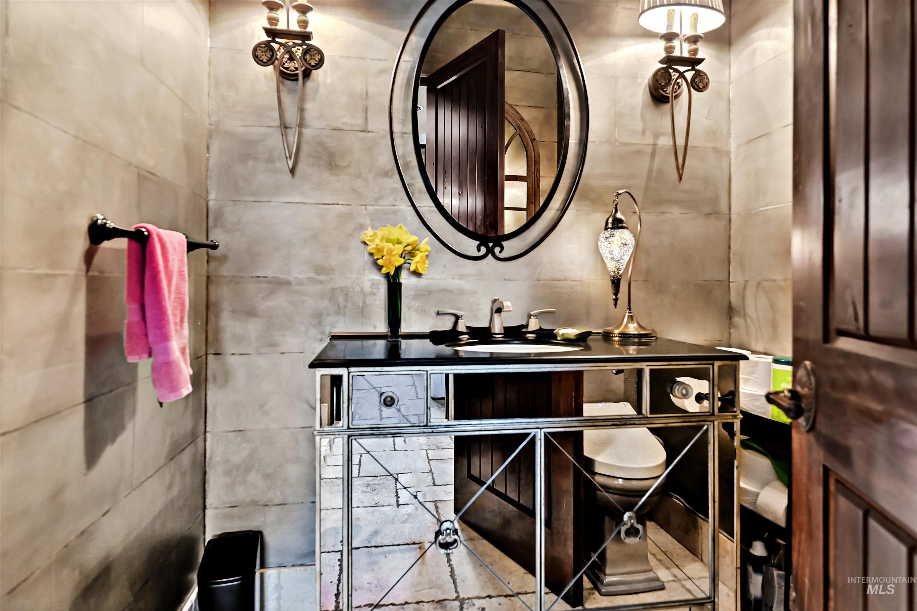 Half bathroom featuring vanity