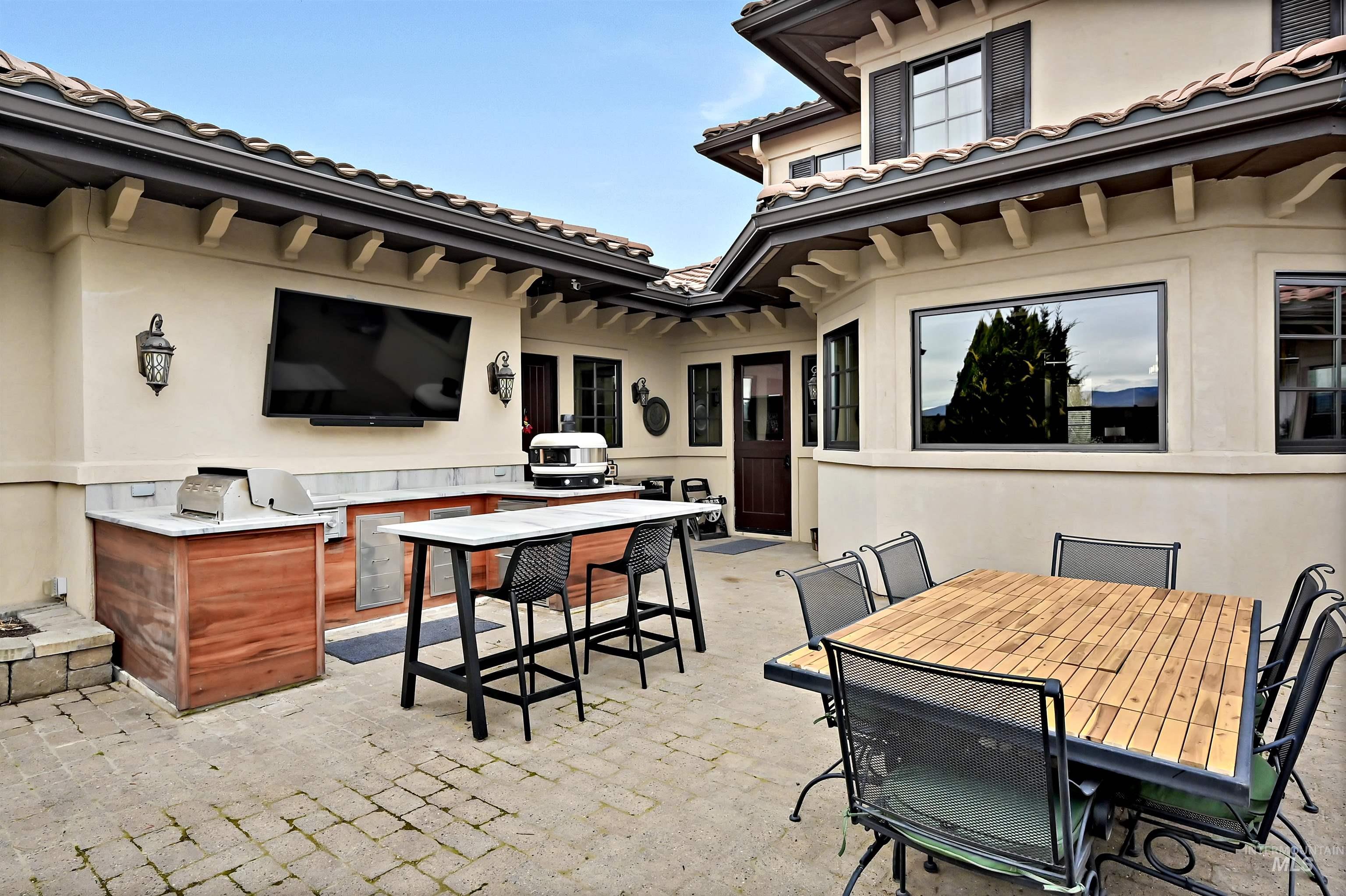 View of patio with an outdoor kitchen / dining area