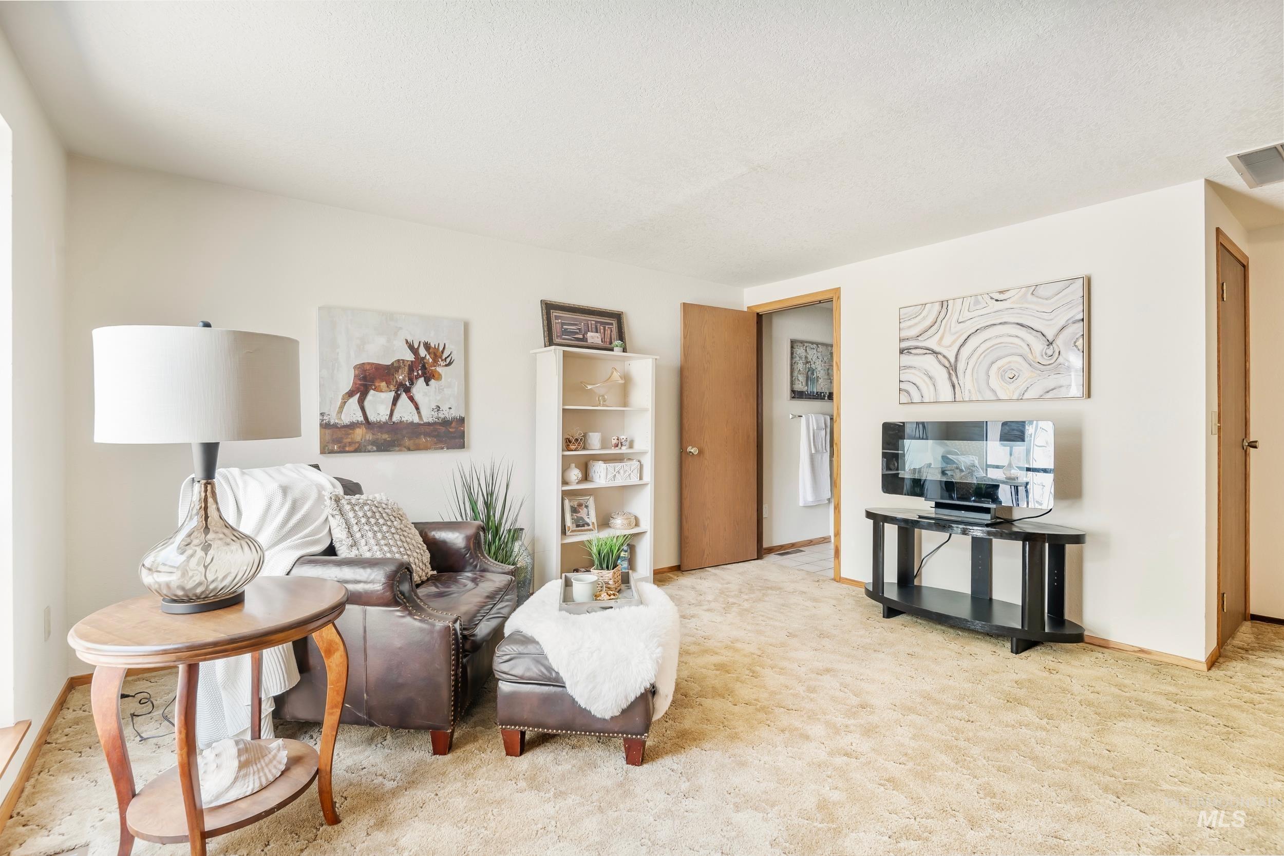 Living room featuring light carpet