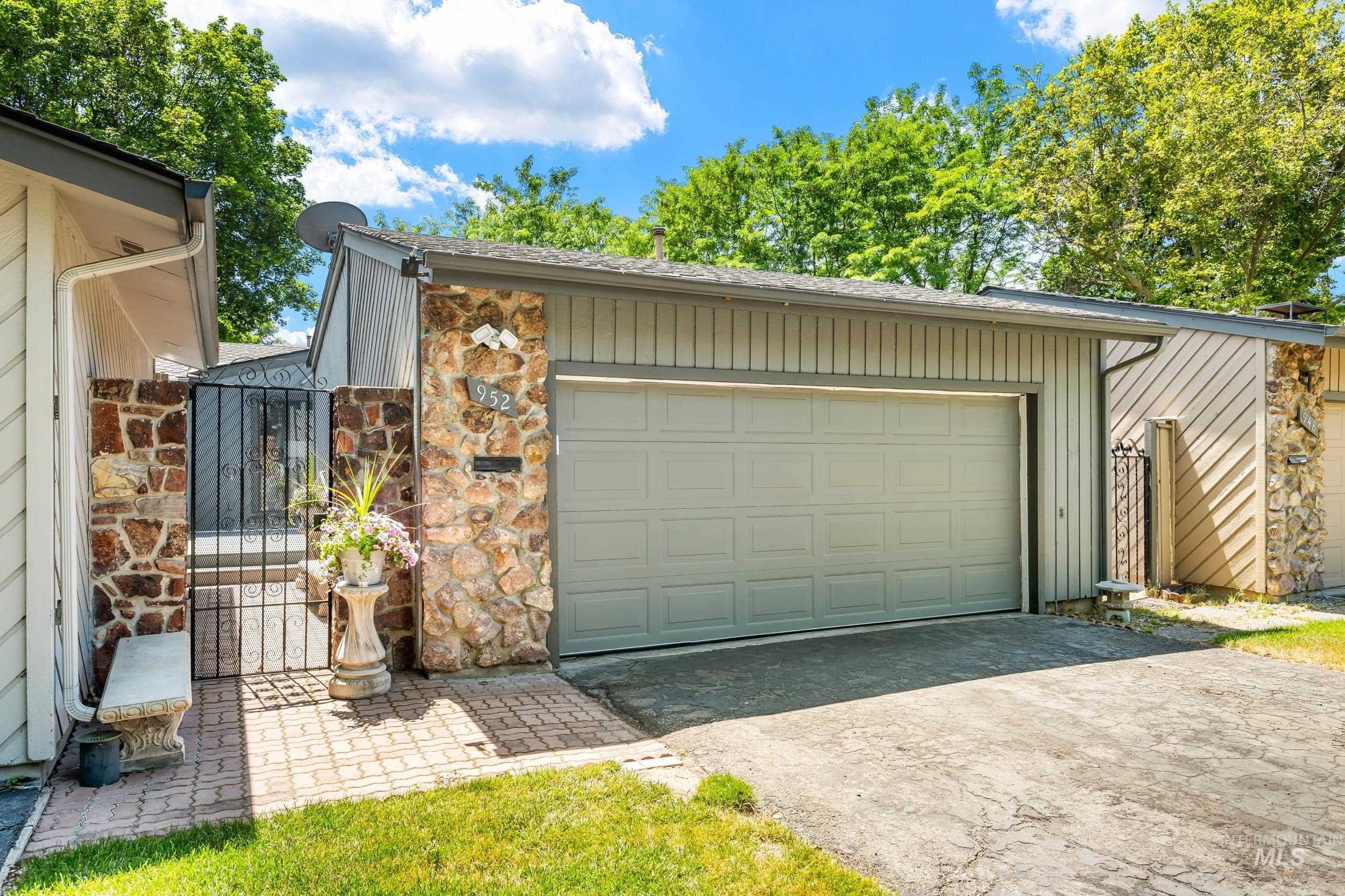 Garage with a gate and driveway