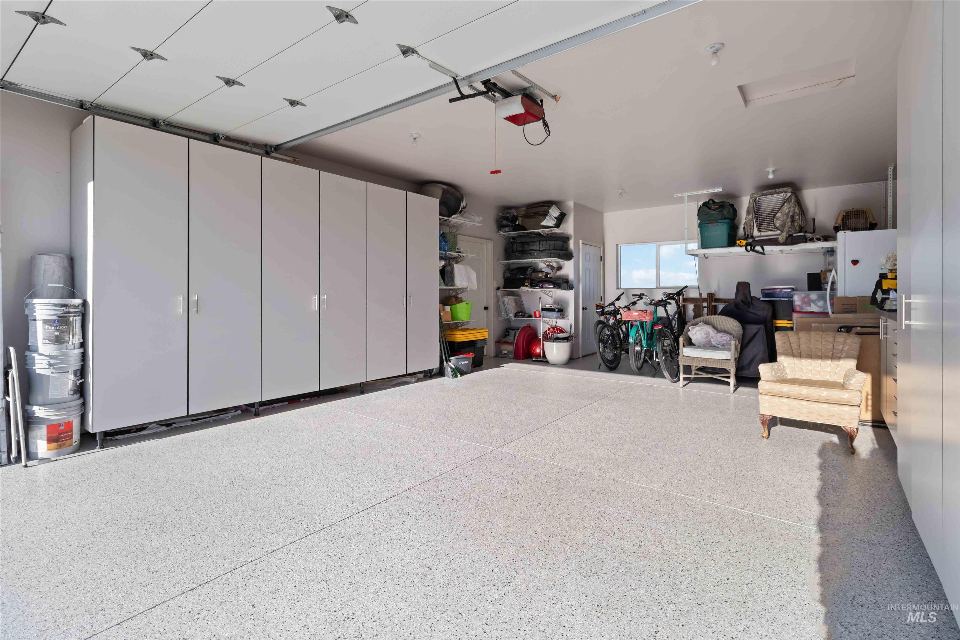 30x30 with epoxy flooring and custom cabinets