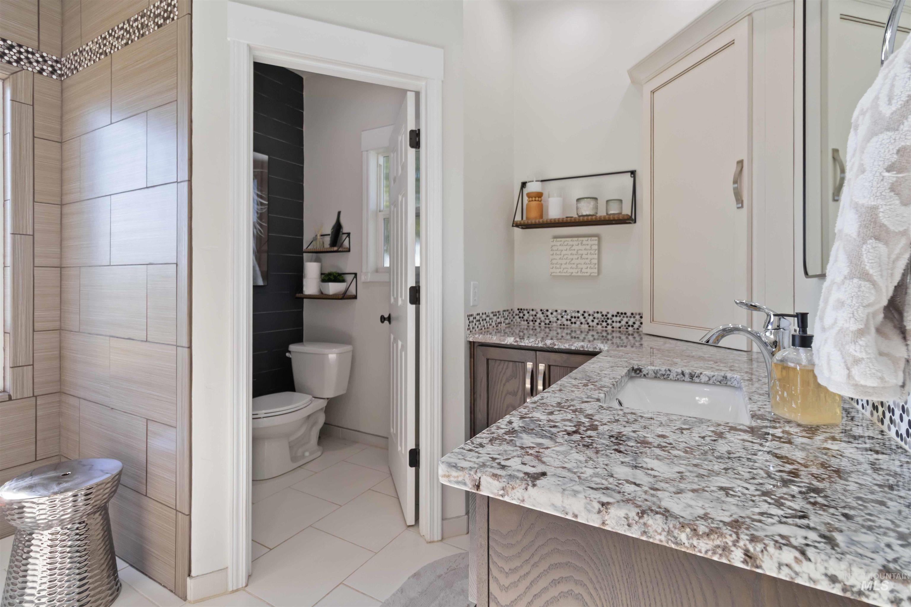 Bathroom featuring vanity and light tile patterned floors