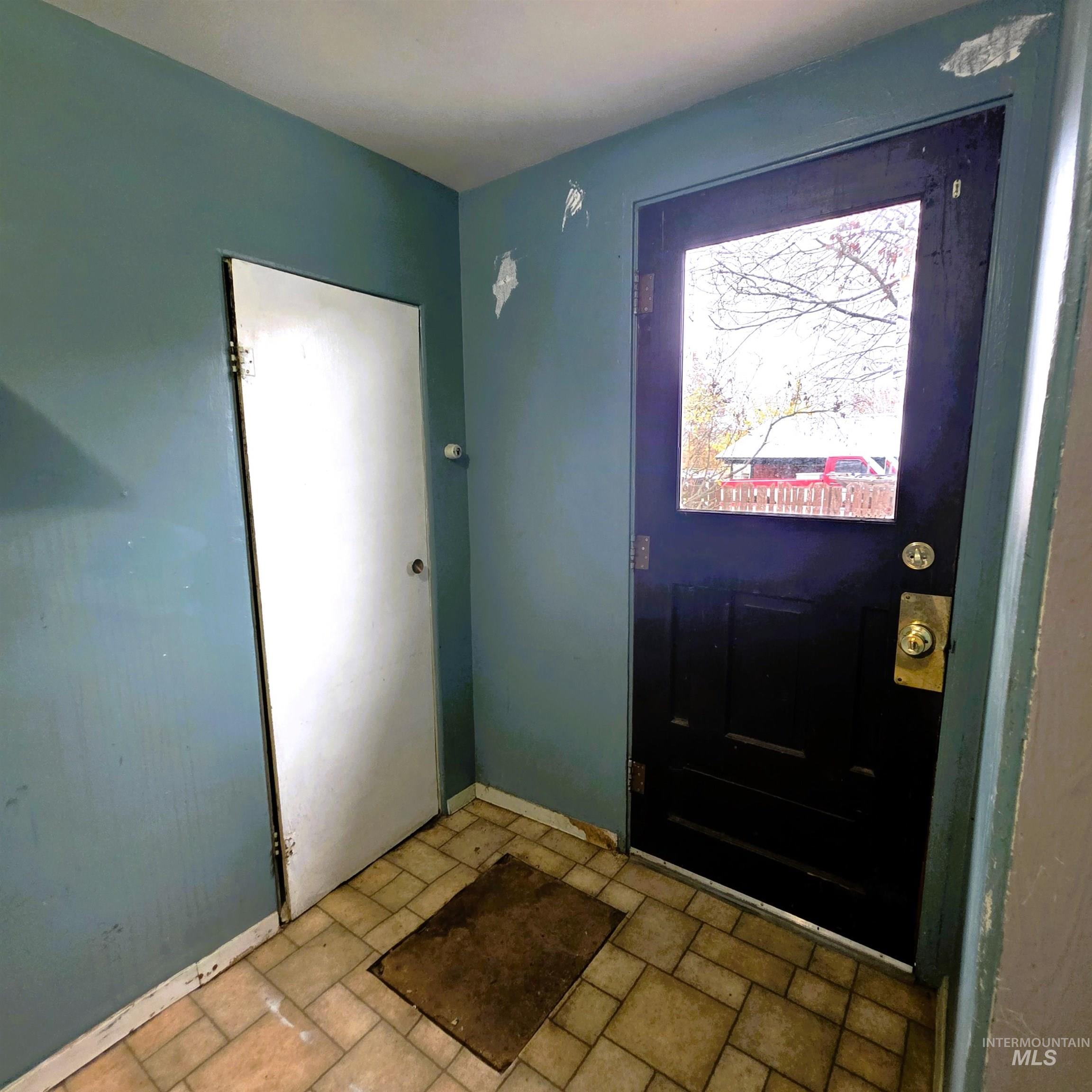 Foyer featuring baseboards