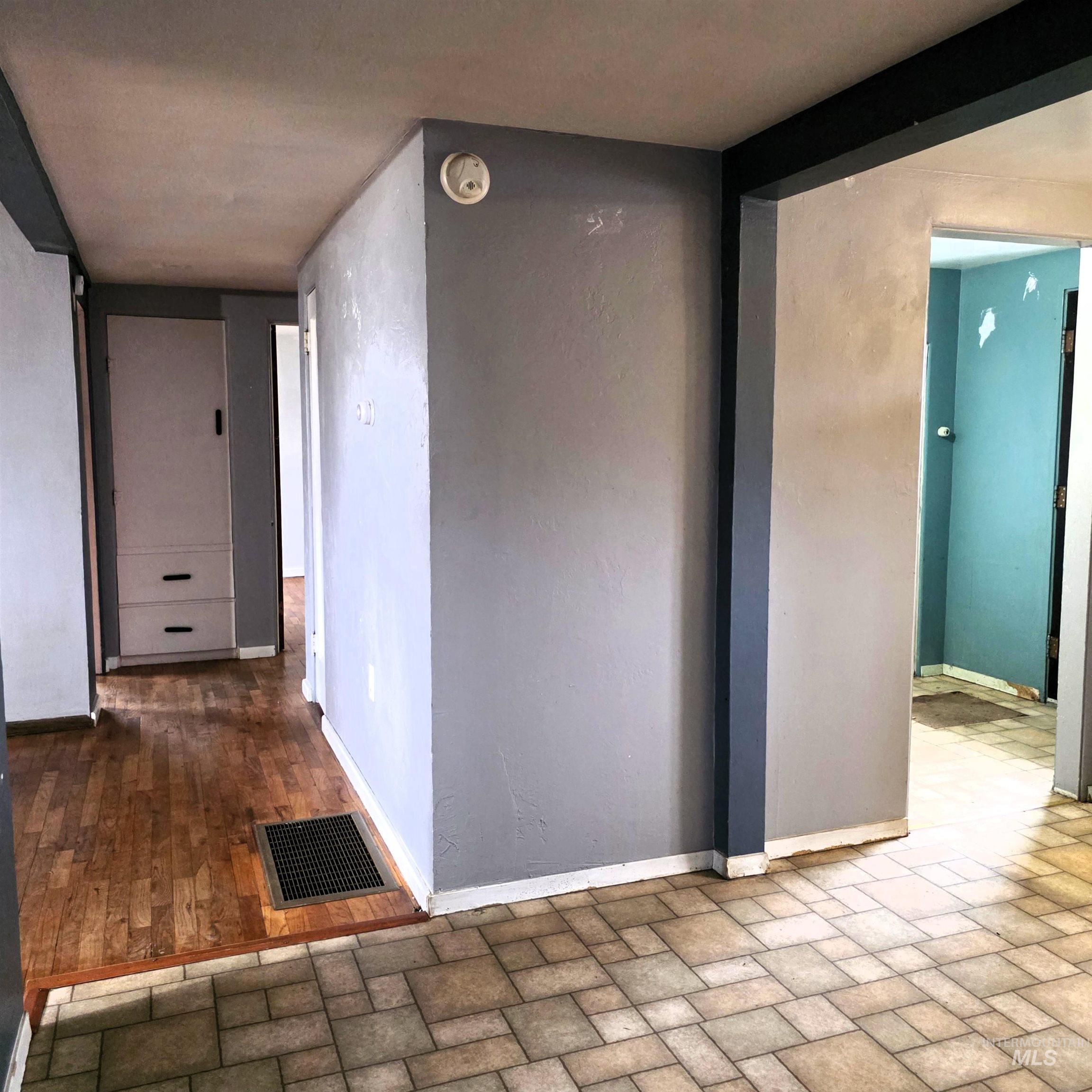 Hallway featuring baseboards