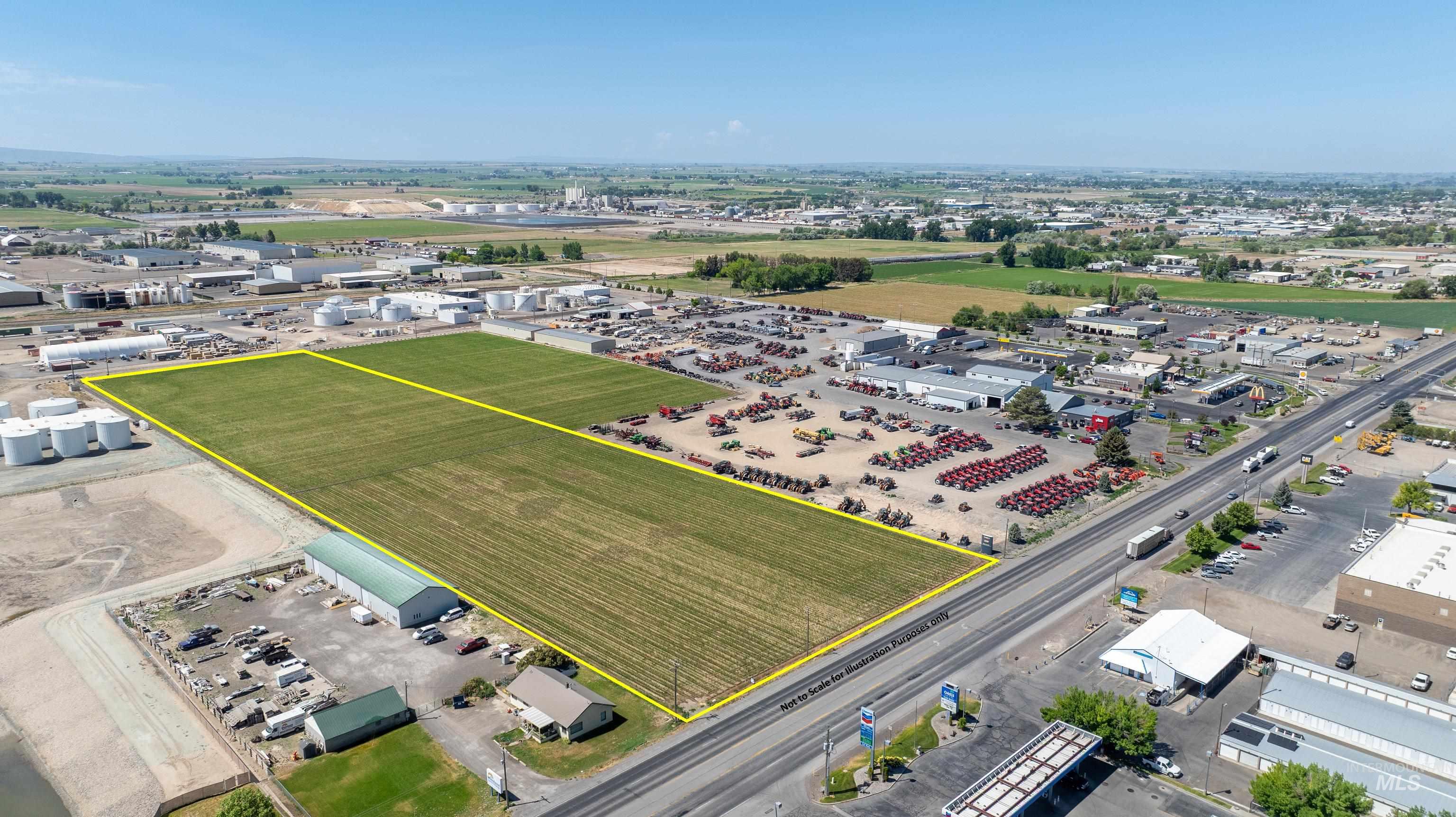Aerial view of property and surrounding area with property parcel outlined