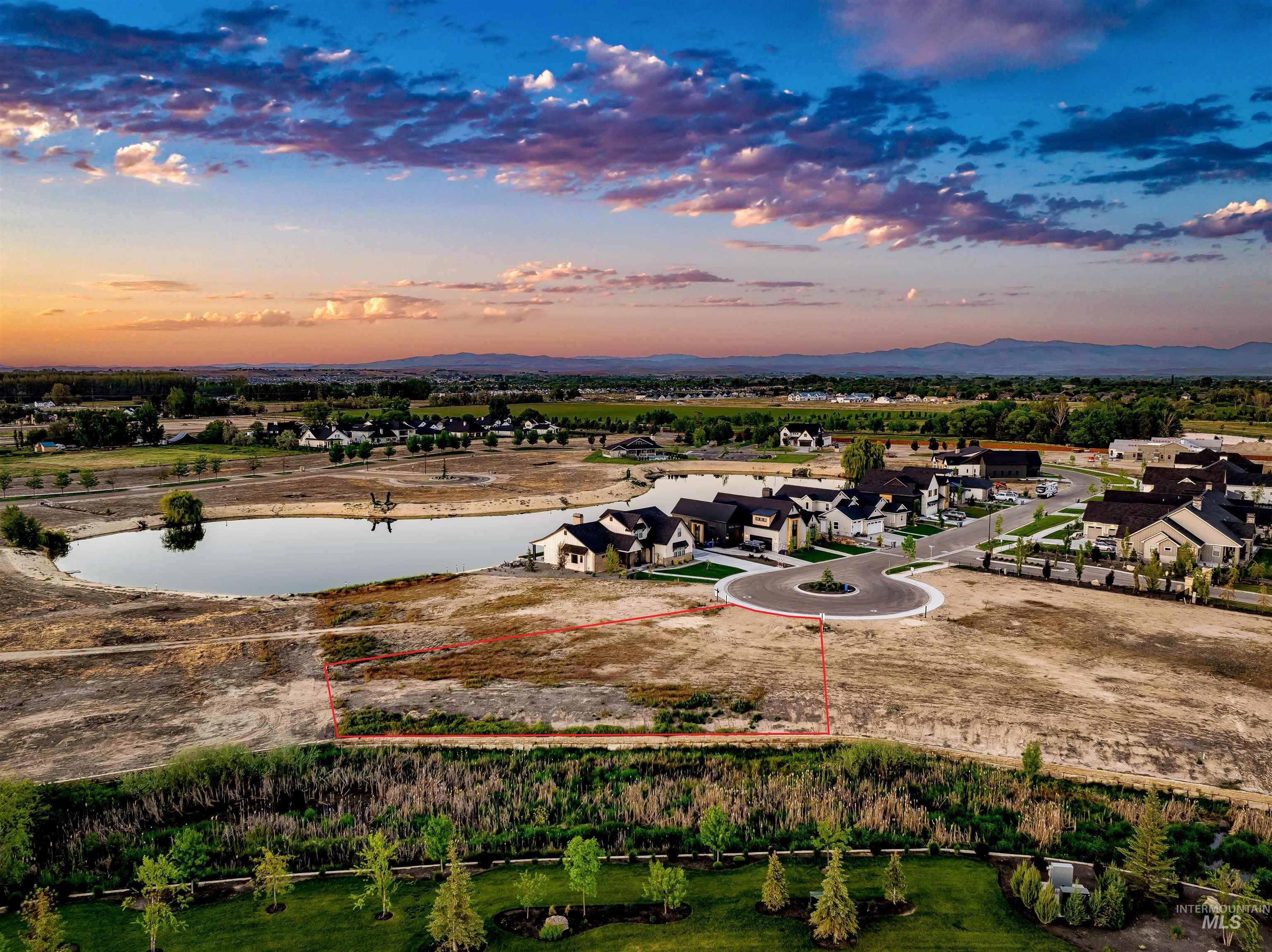 Aerial view at dusk of property boundaries highlighted, a water view, and a residential view