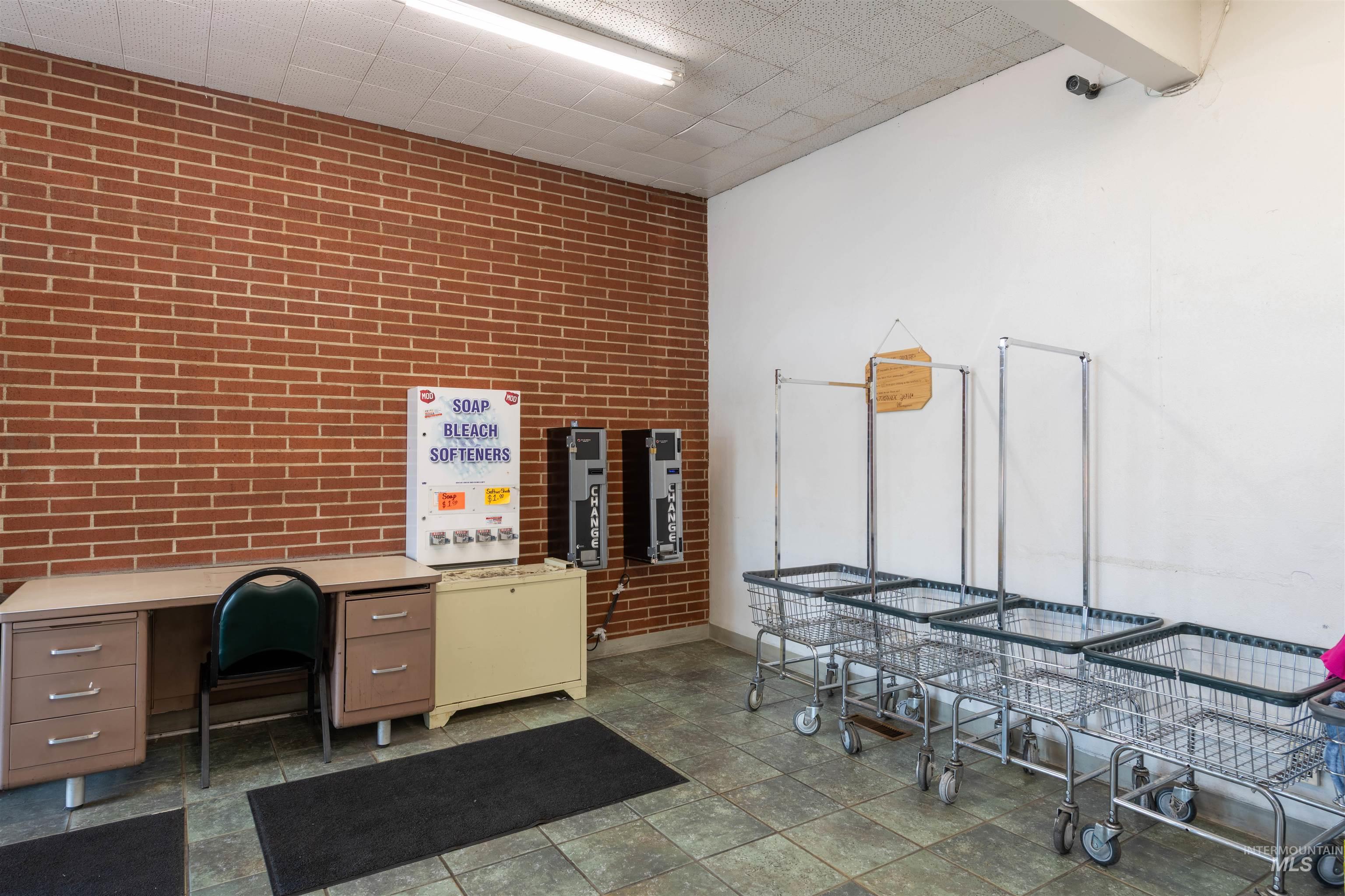 Office featuring brick wall