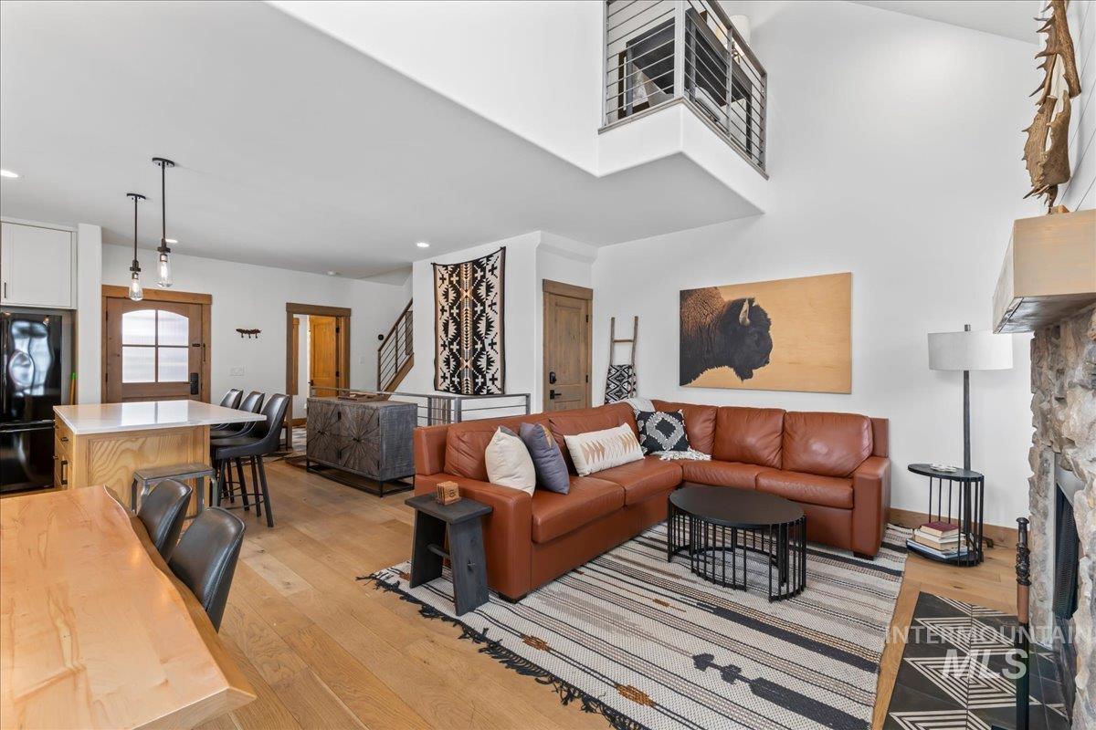 Living room with light wood finished floors and a fireplace