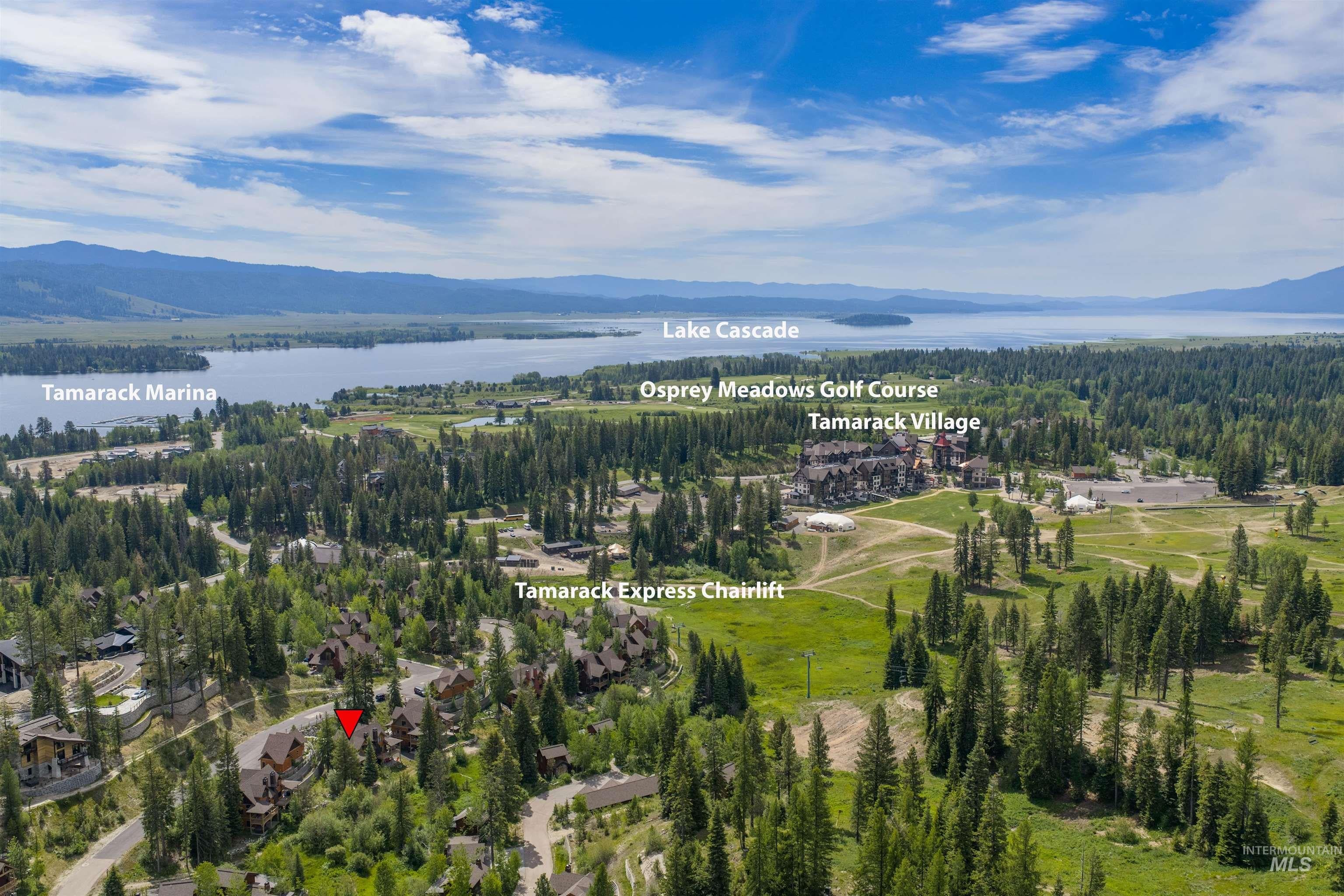 Aerial panorama showcasing Lake Cascade and surrounding forested terrain