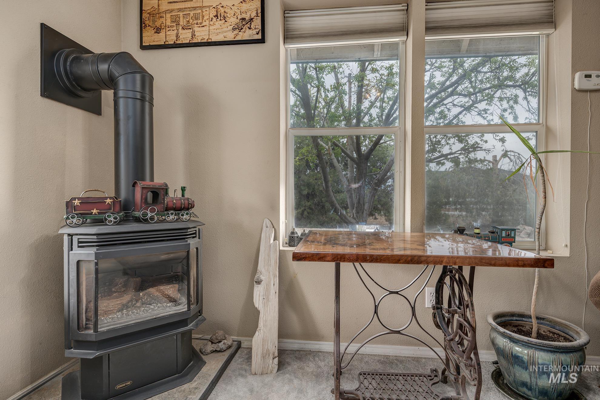 Detailed view of a wood stove and a textured wall
