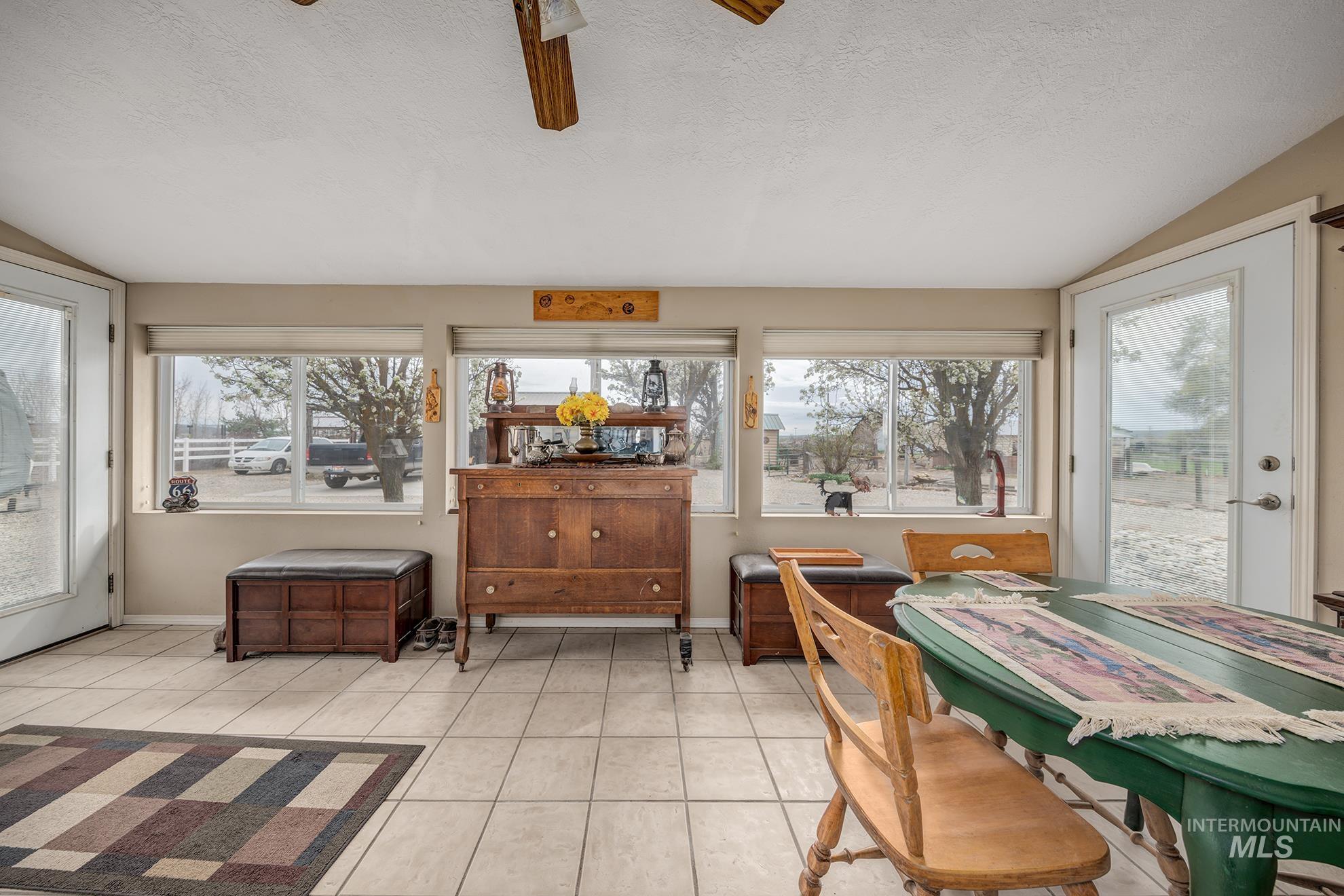 Sunroom featuring lofted ceiling and healthy amount of natural light