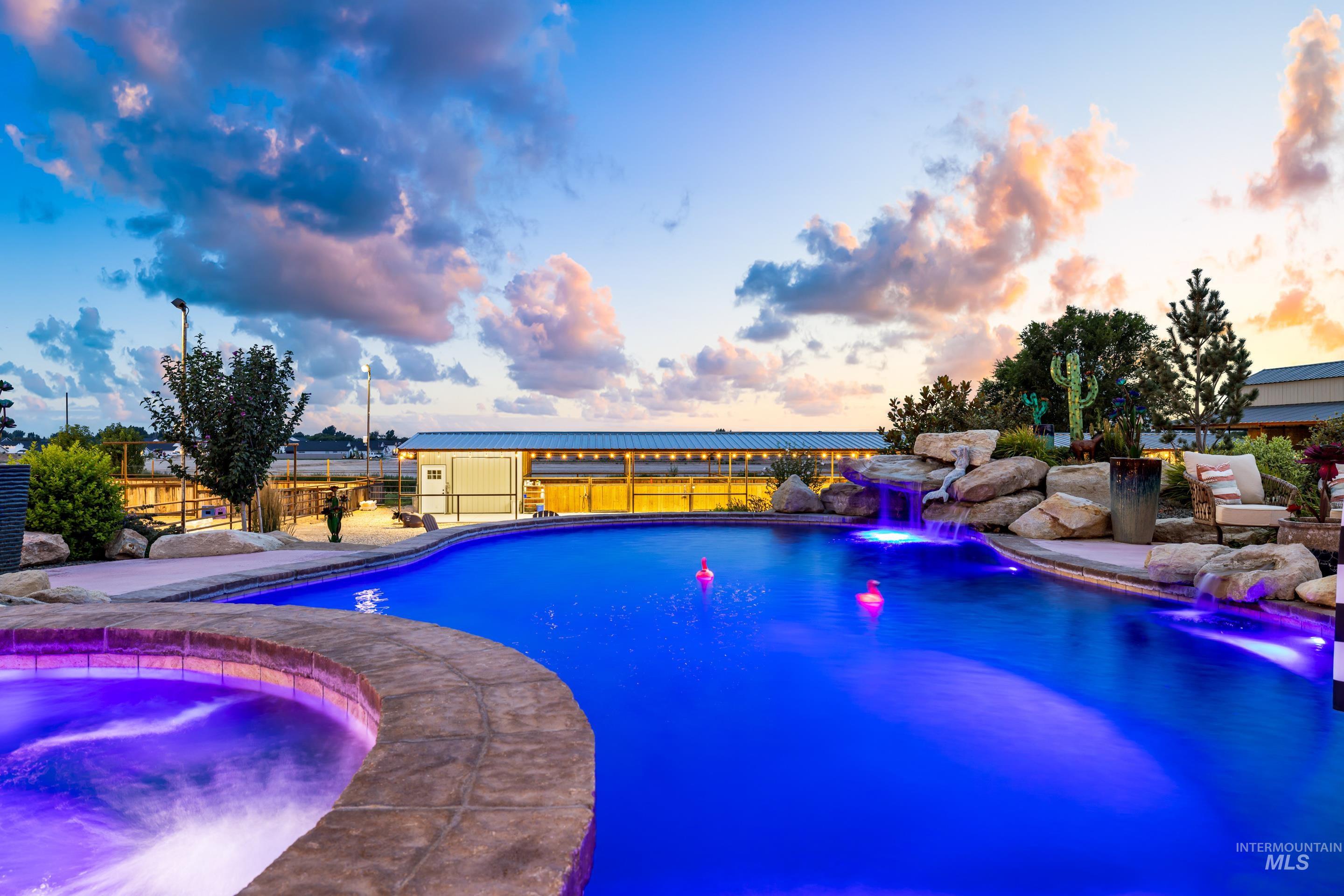 View of pool featuring an in-ground hot tub