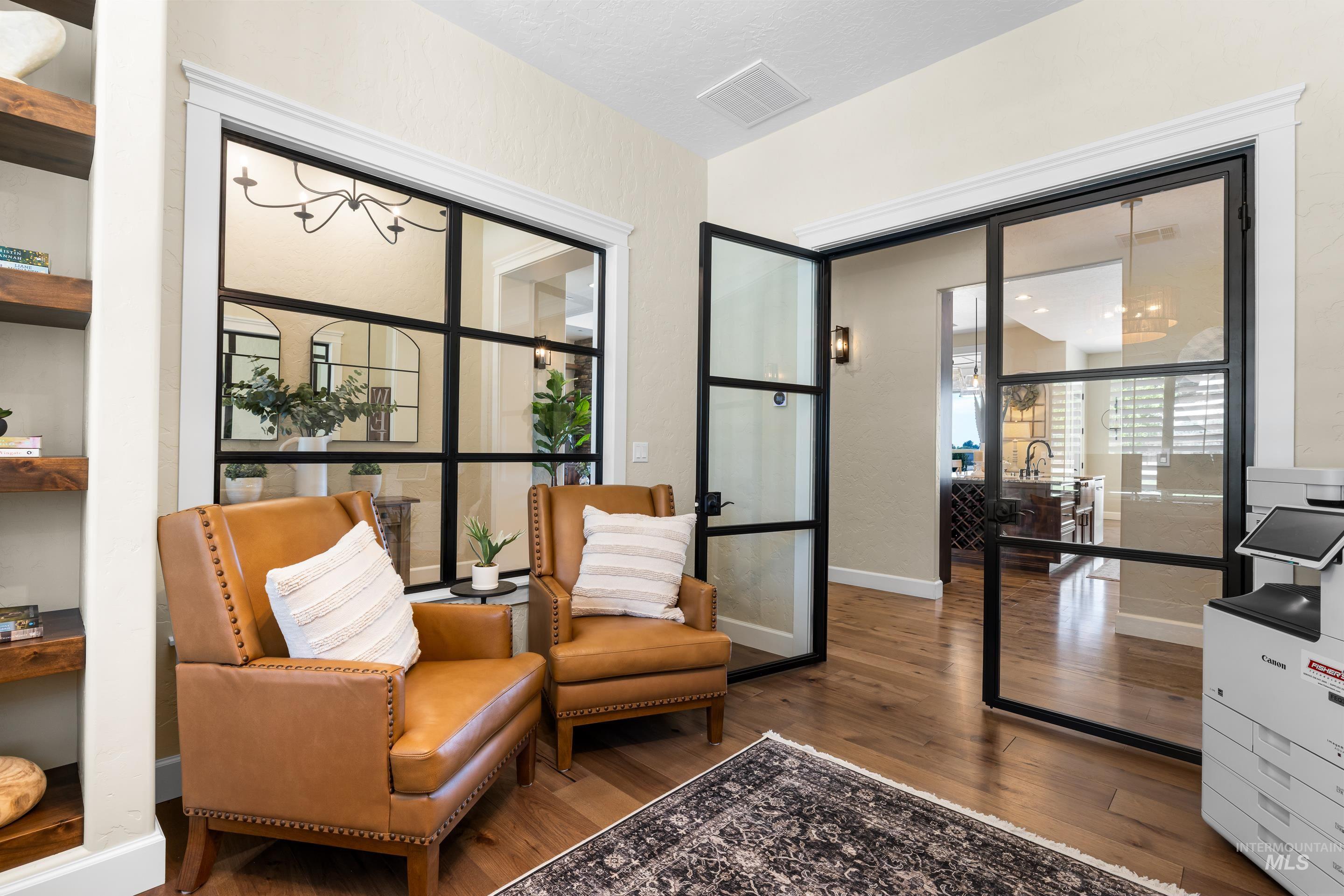 Sitting room featuring wood finished floors and baseboards