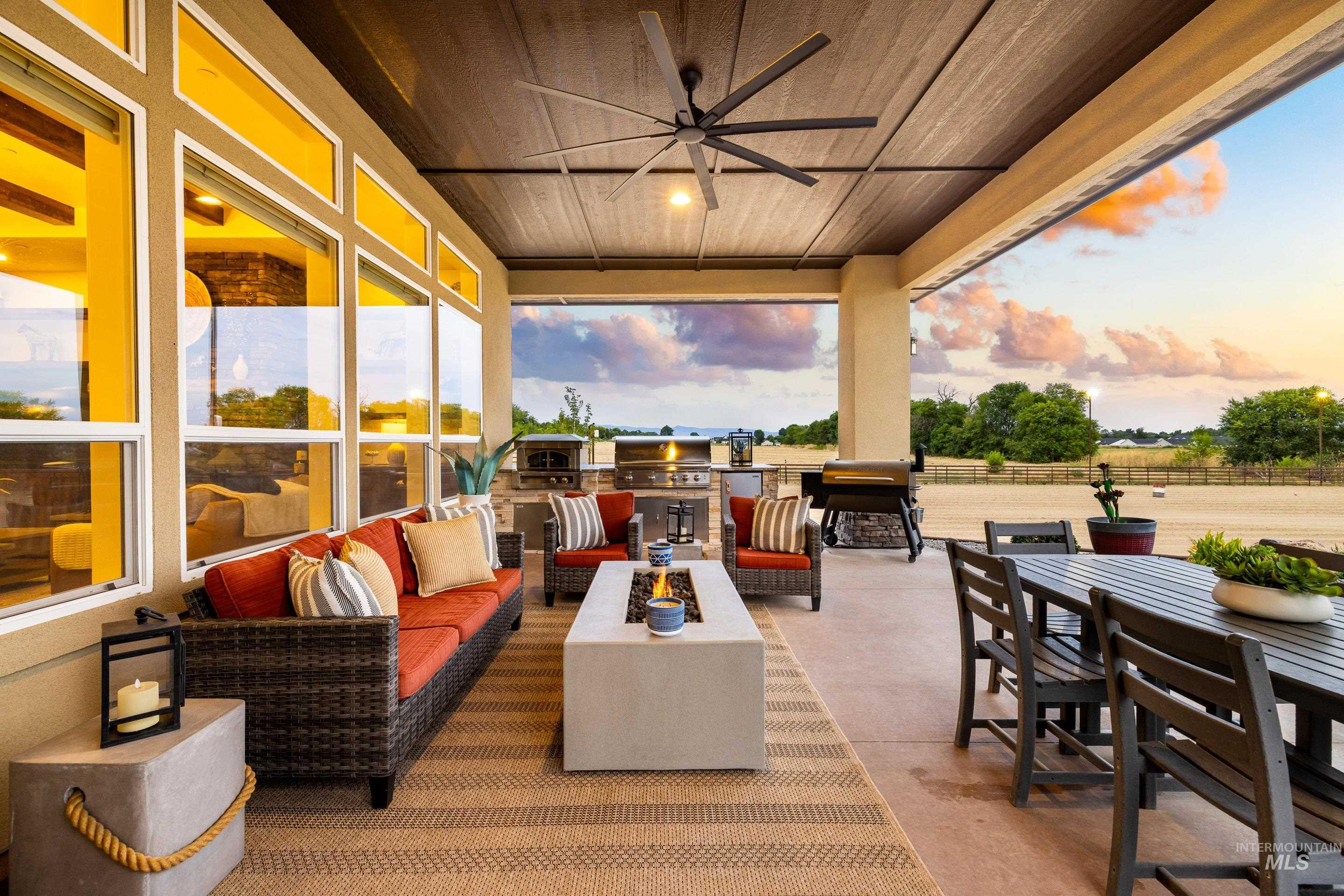 View of patio / terrace featuring outdoor lounge area, outdoor dining space, area for grilling, and a ceiling fan