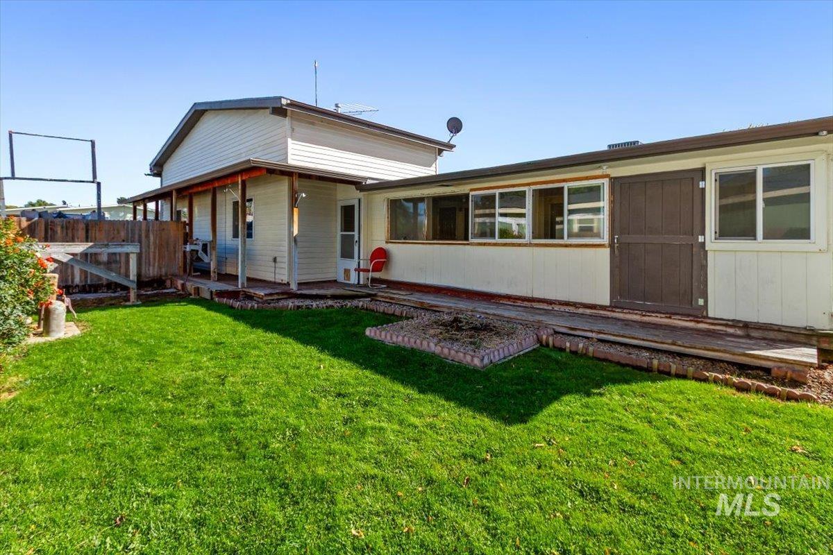 Back of property with a wooden deck