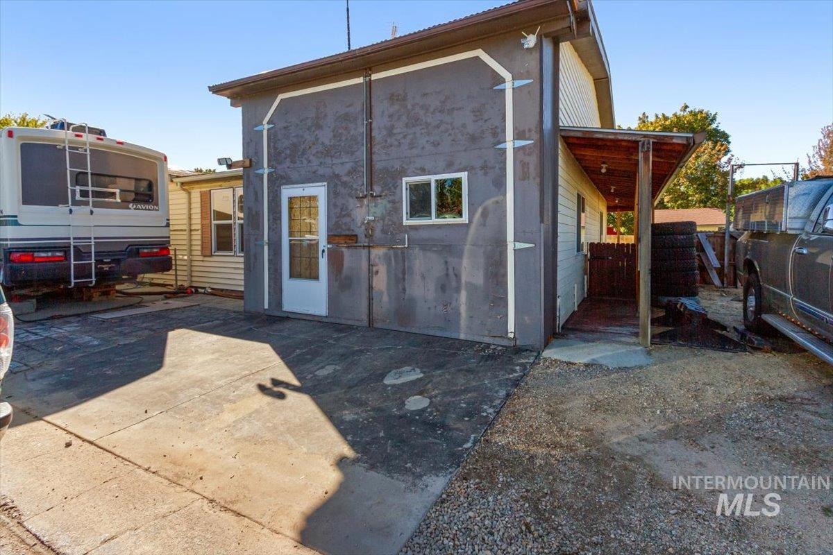 Rear view of property with a patio and stucco siding