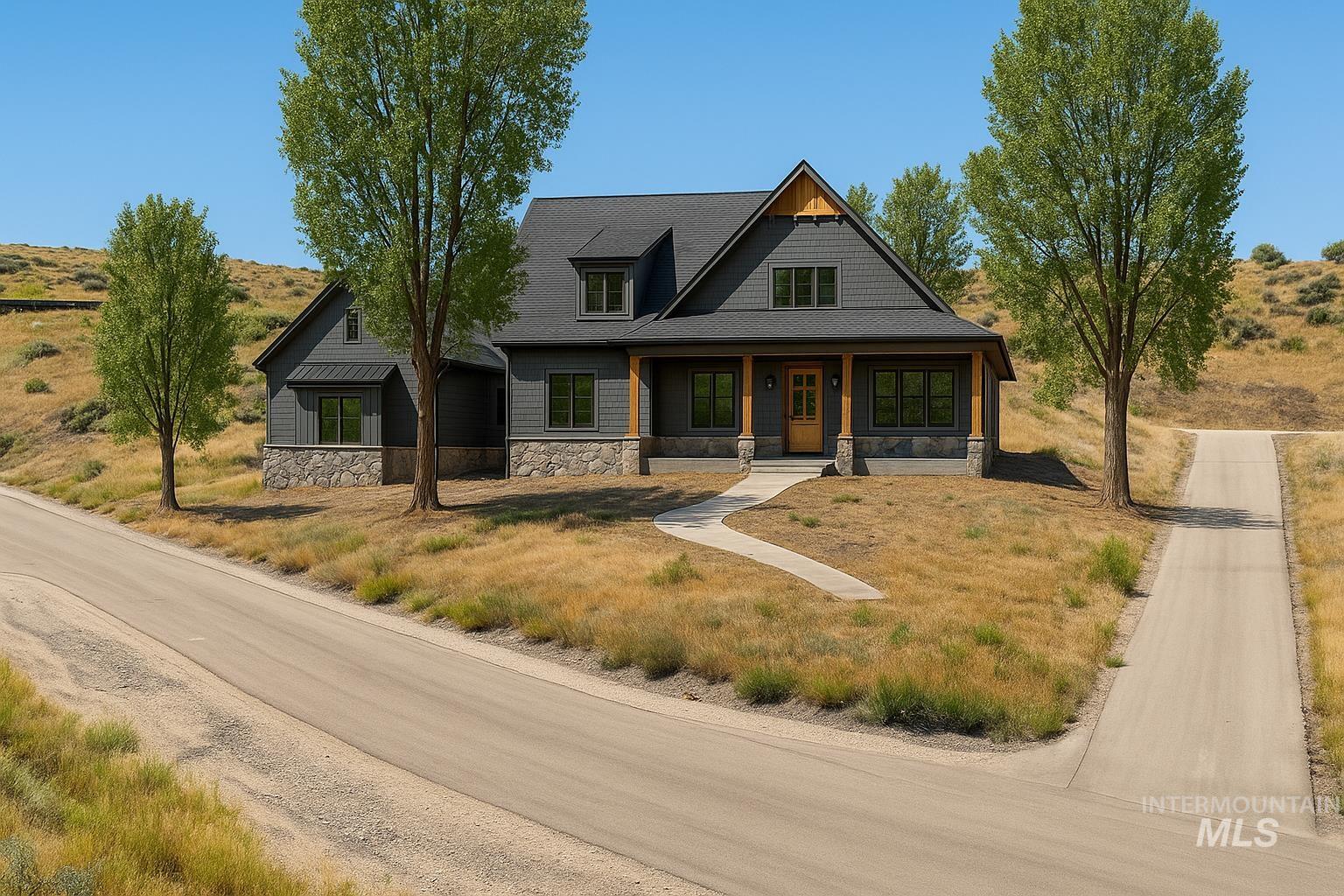 View of front facade with covered porch and stone siding