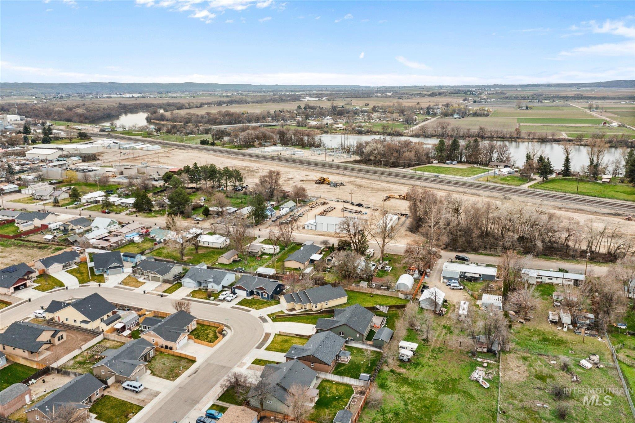 Aerial perspective of suburban area with a nearby body of water