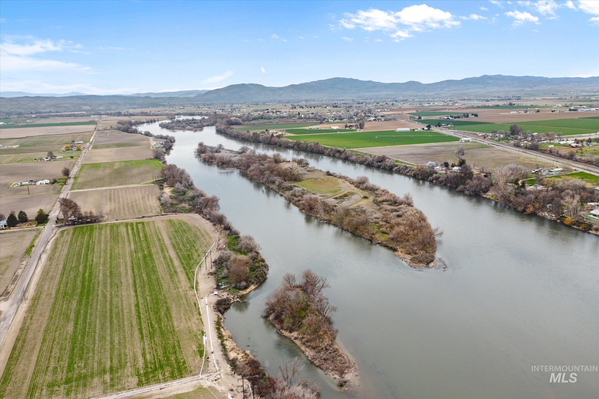 Overview of rural landscape with a water and mountain view
