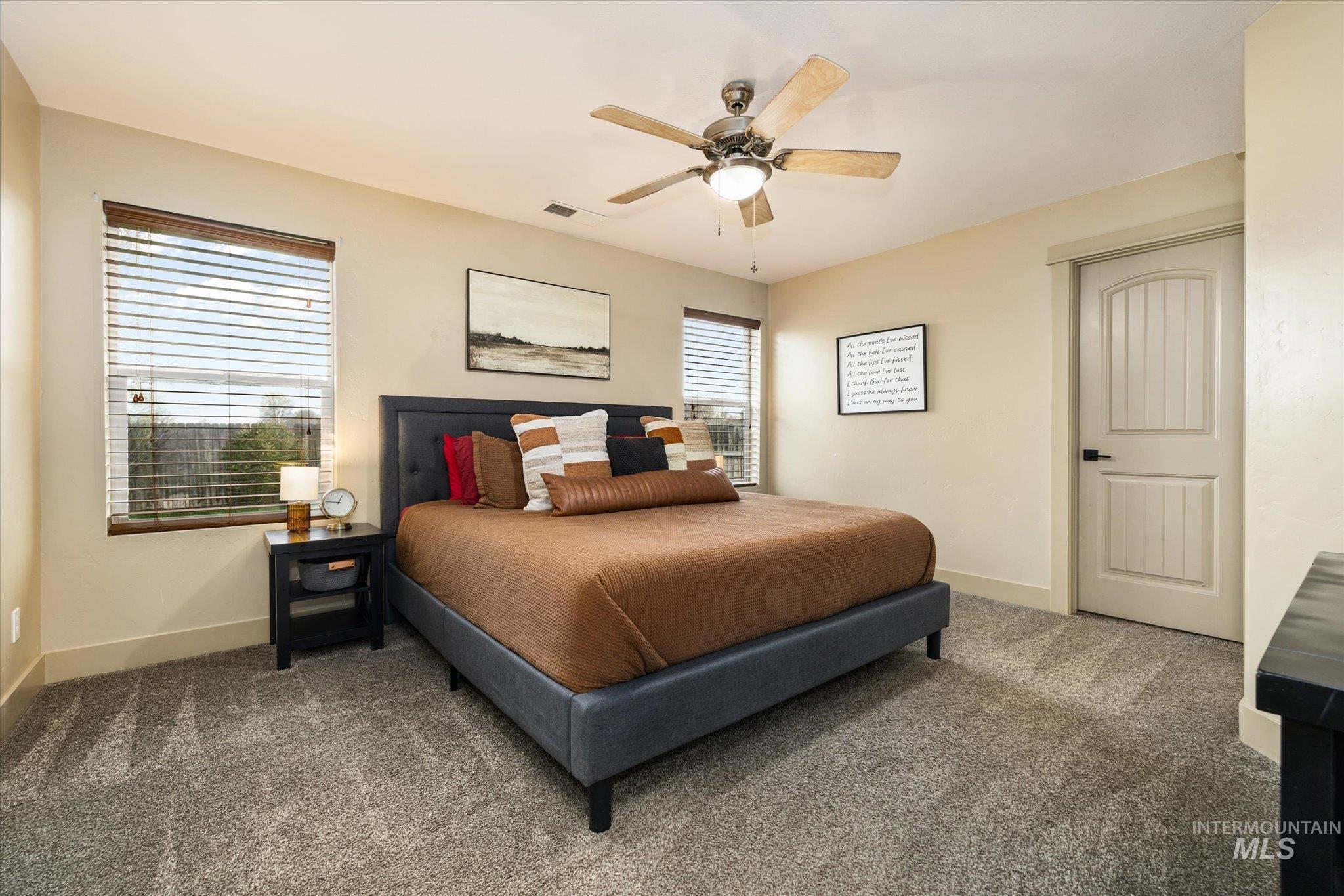 Bedroom featuring carpet and ceiling fan