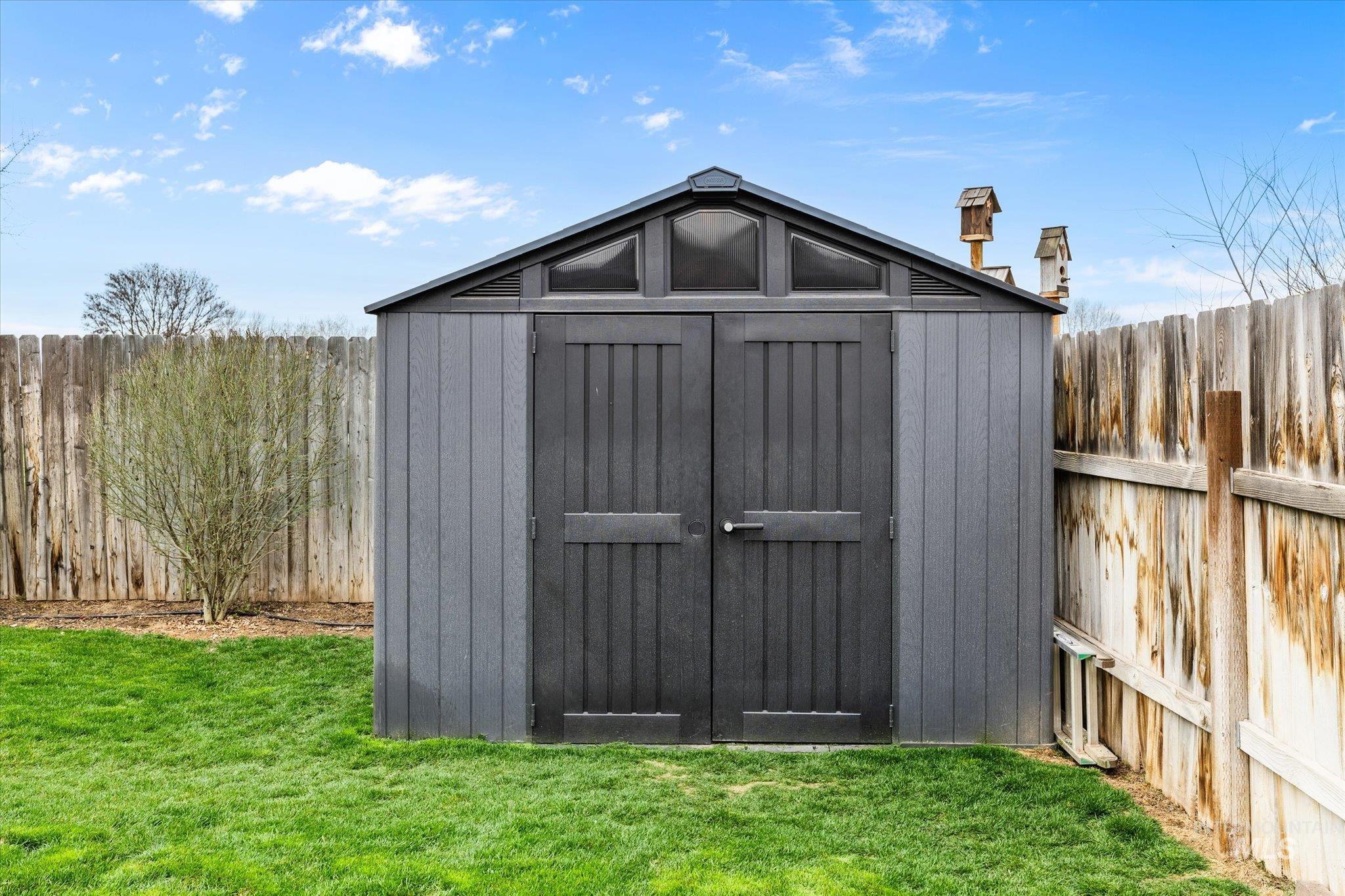 View of shed featuring a fenced backyard