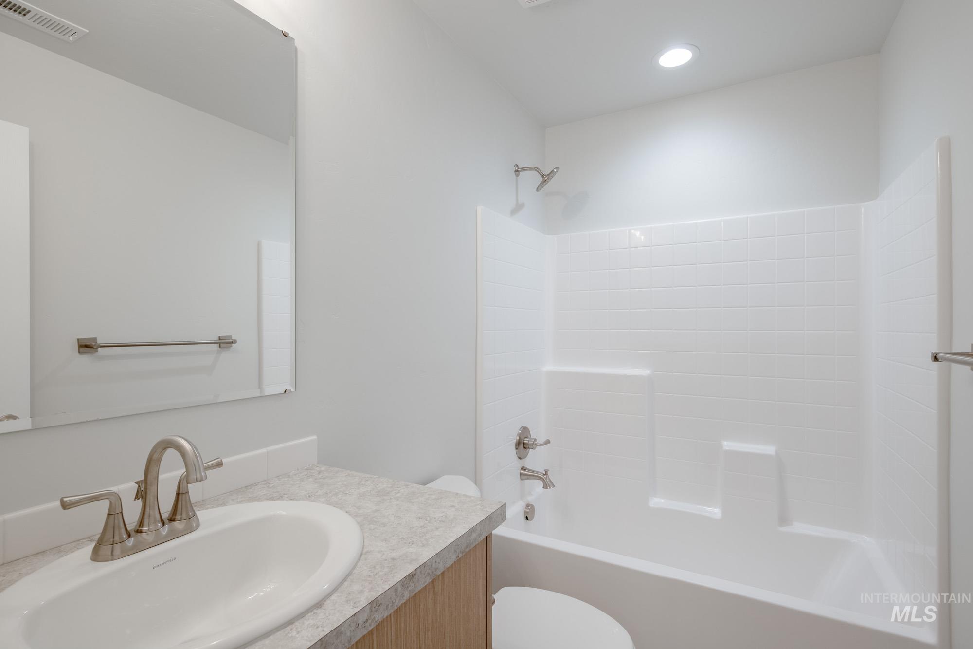 Full bathroom featuring  shower combination and vanity