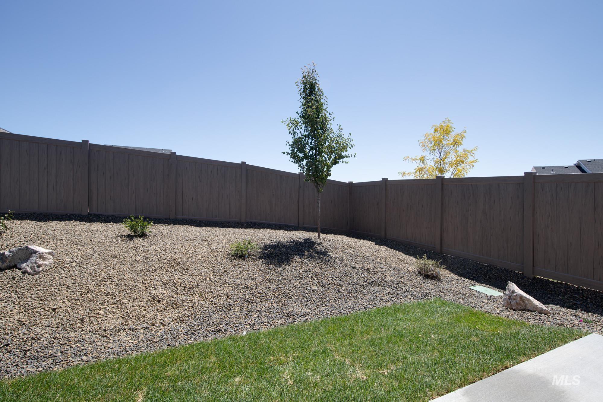View of fenced backyard