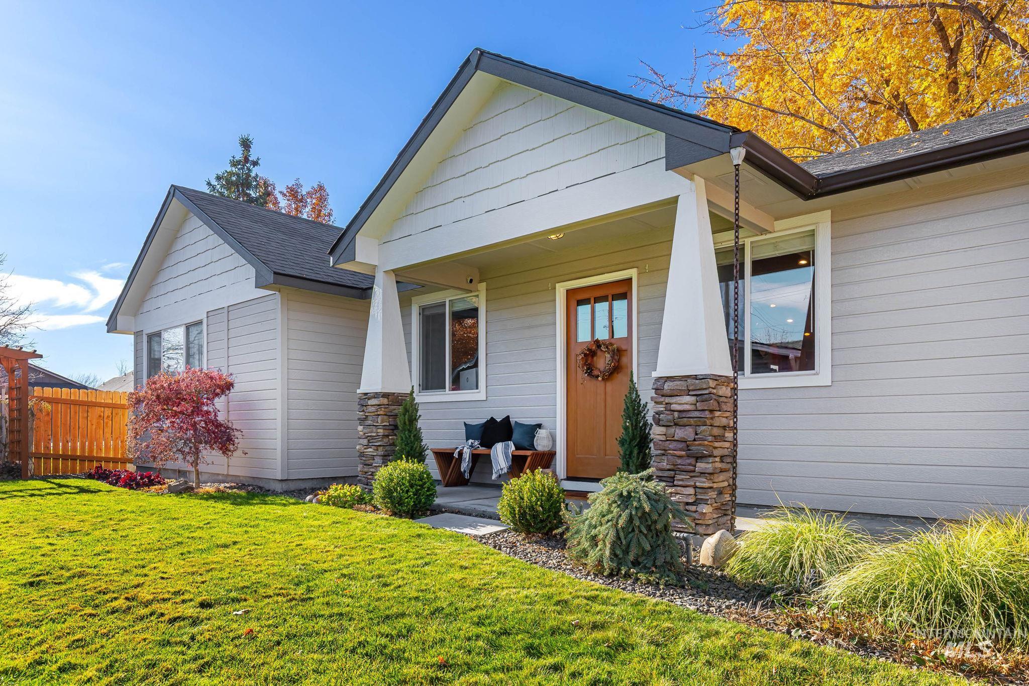 Craftsman-style home featuring a porch and a shingled roof