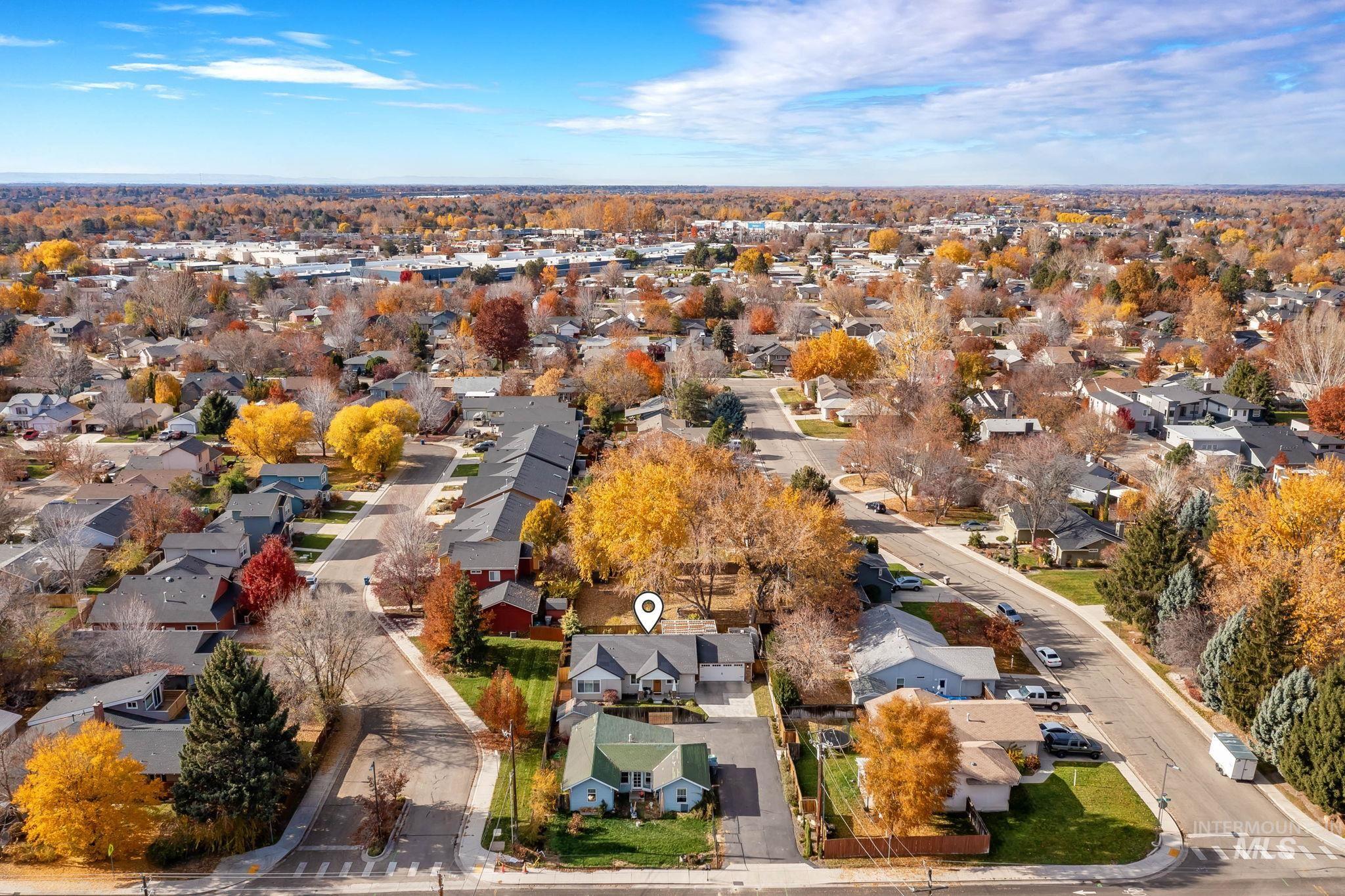 View of property location with nearby suburban area