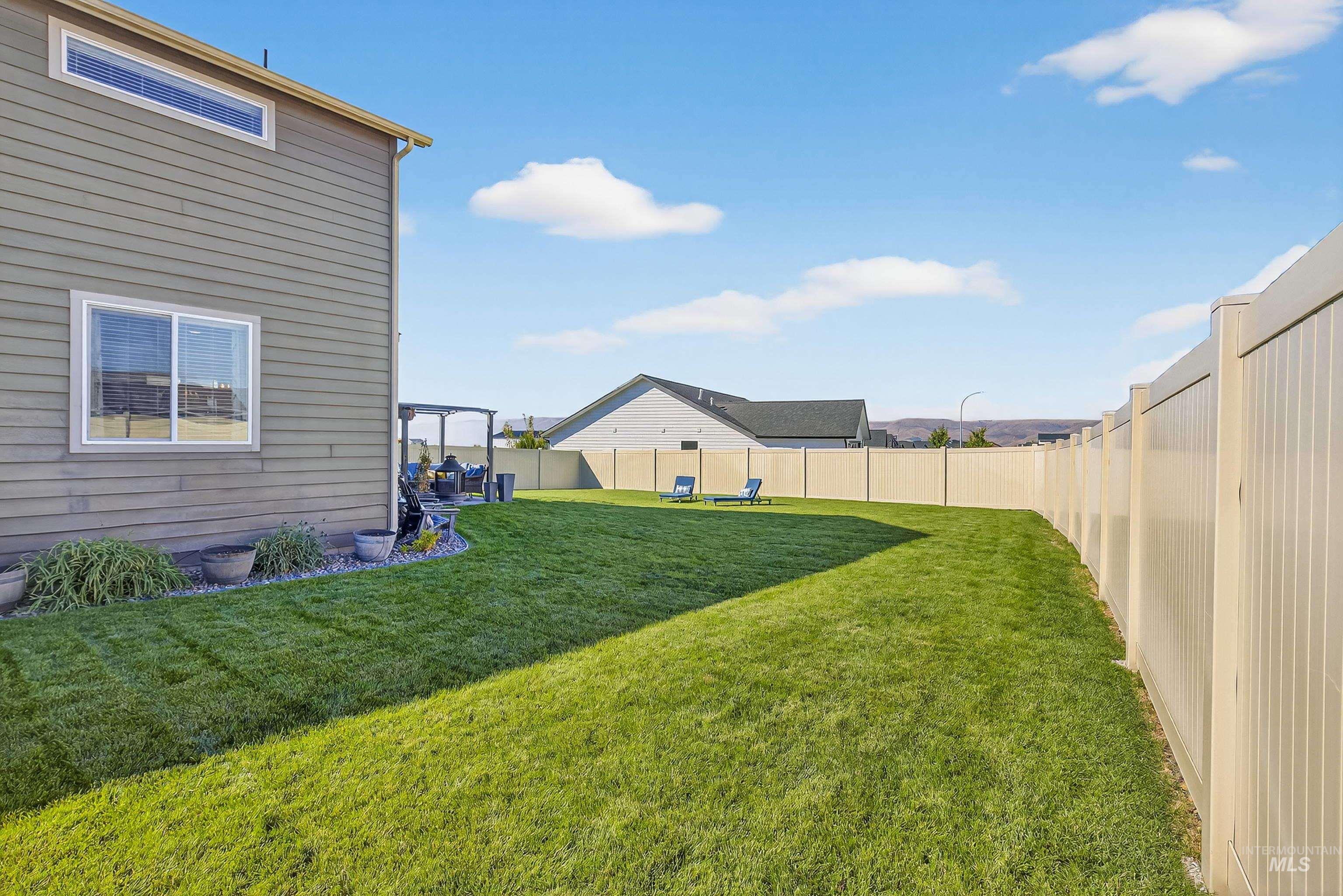 View of fenced backyard