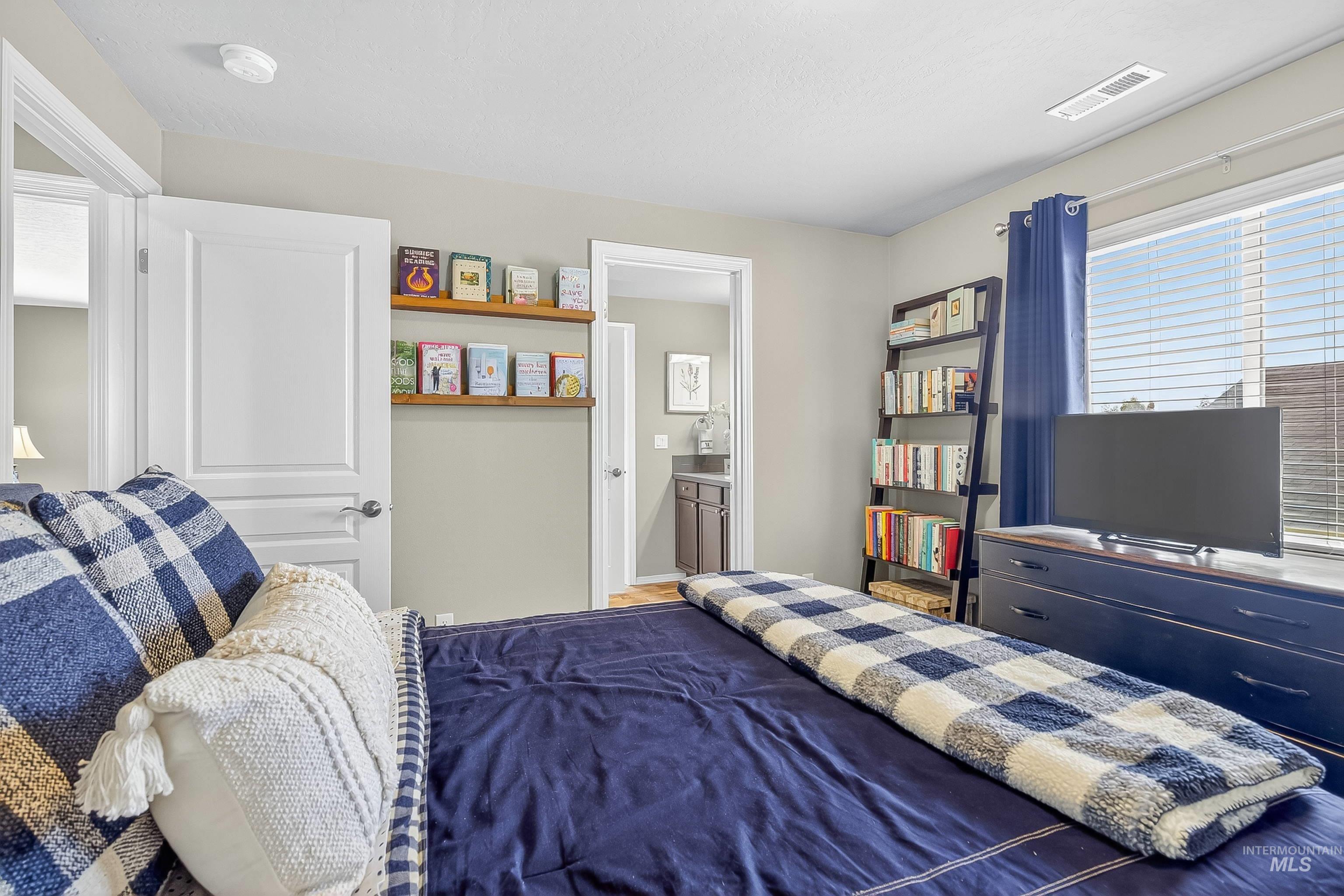 Bedroom featuring ensuite bath