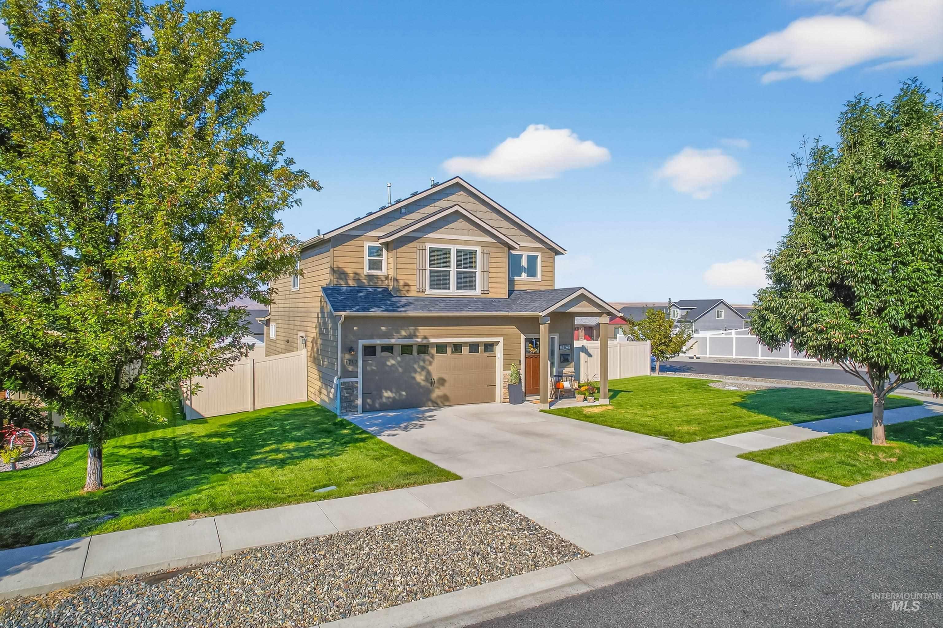 View of front of home featuring driveway and an attached garage