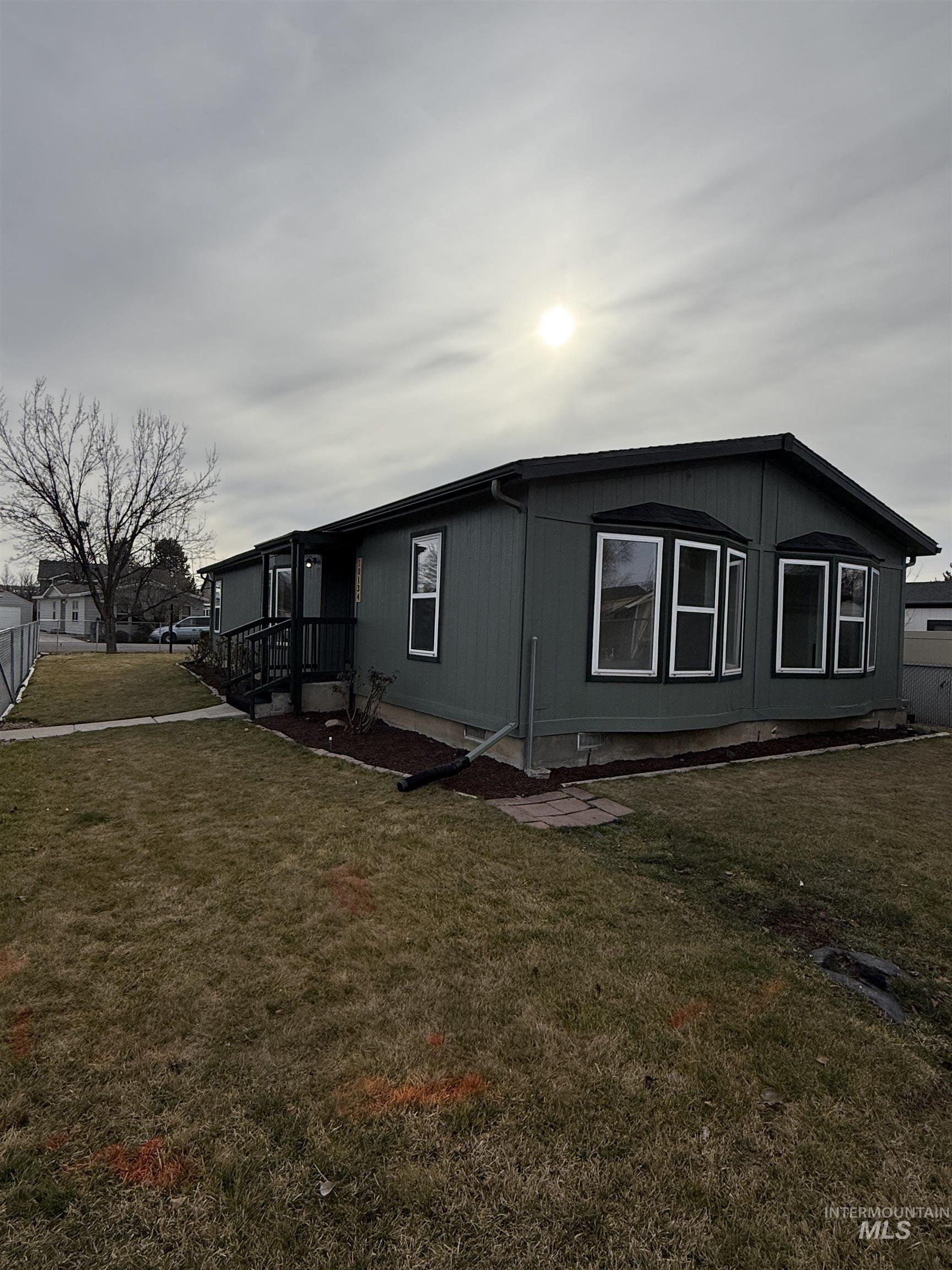 View of home's exterior with a lawn