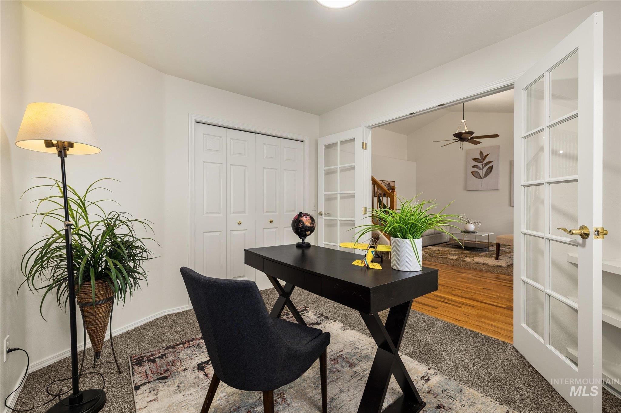Office area featuring french doors and light colored carpet